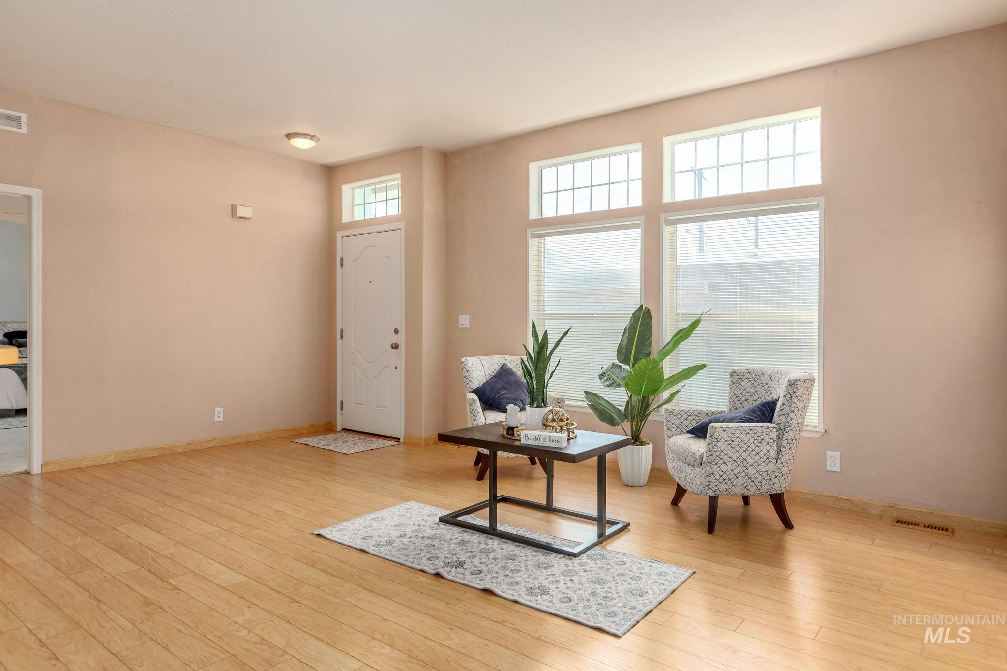 Entrance foyer with light wood-type flooring