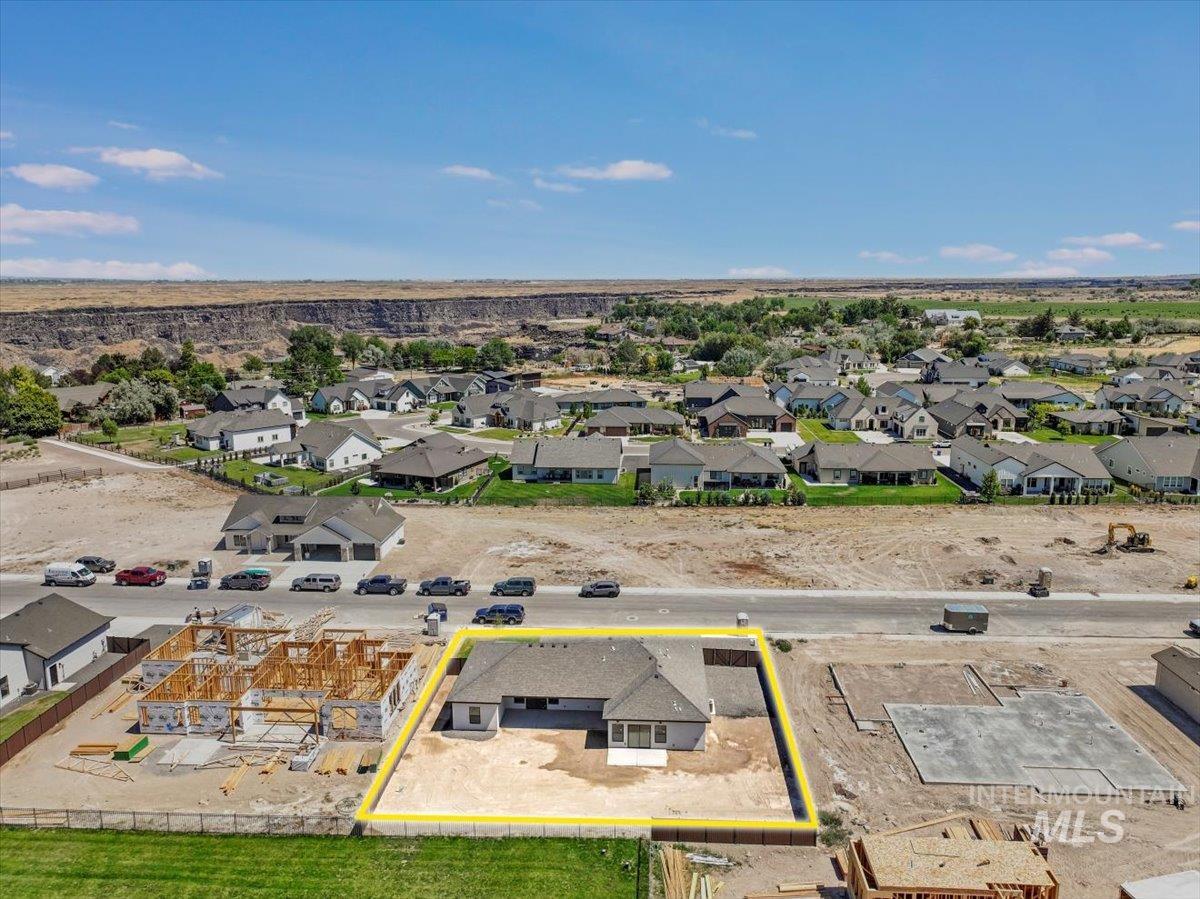 Aerial view of residential area with property parcel outlined