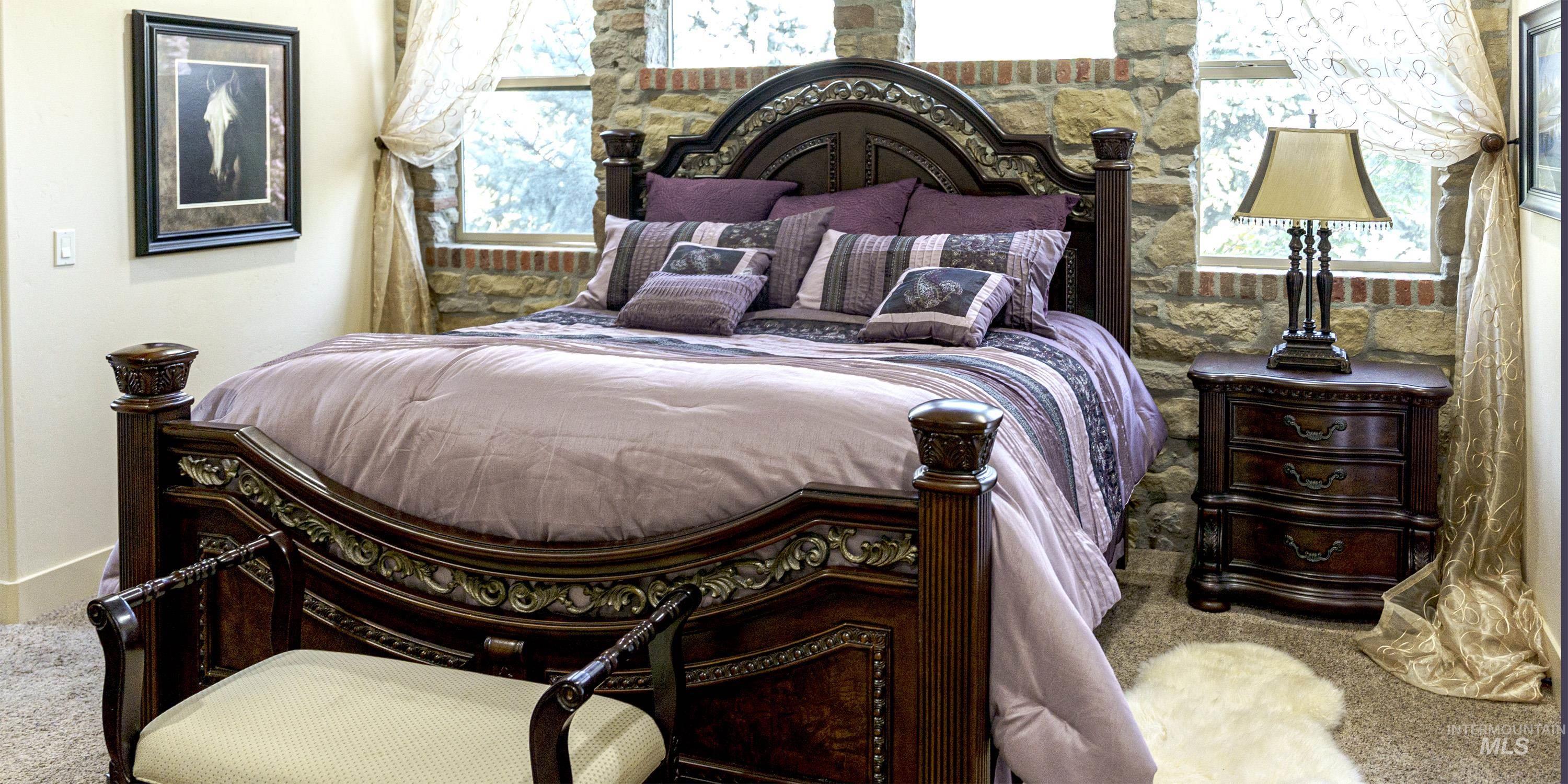 Carpeted bedroom with multiple windows
