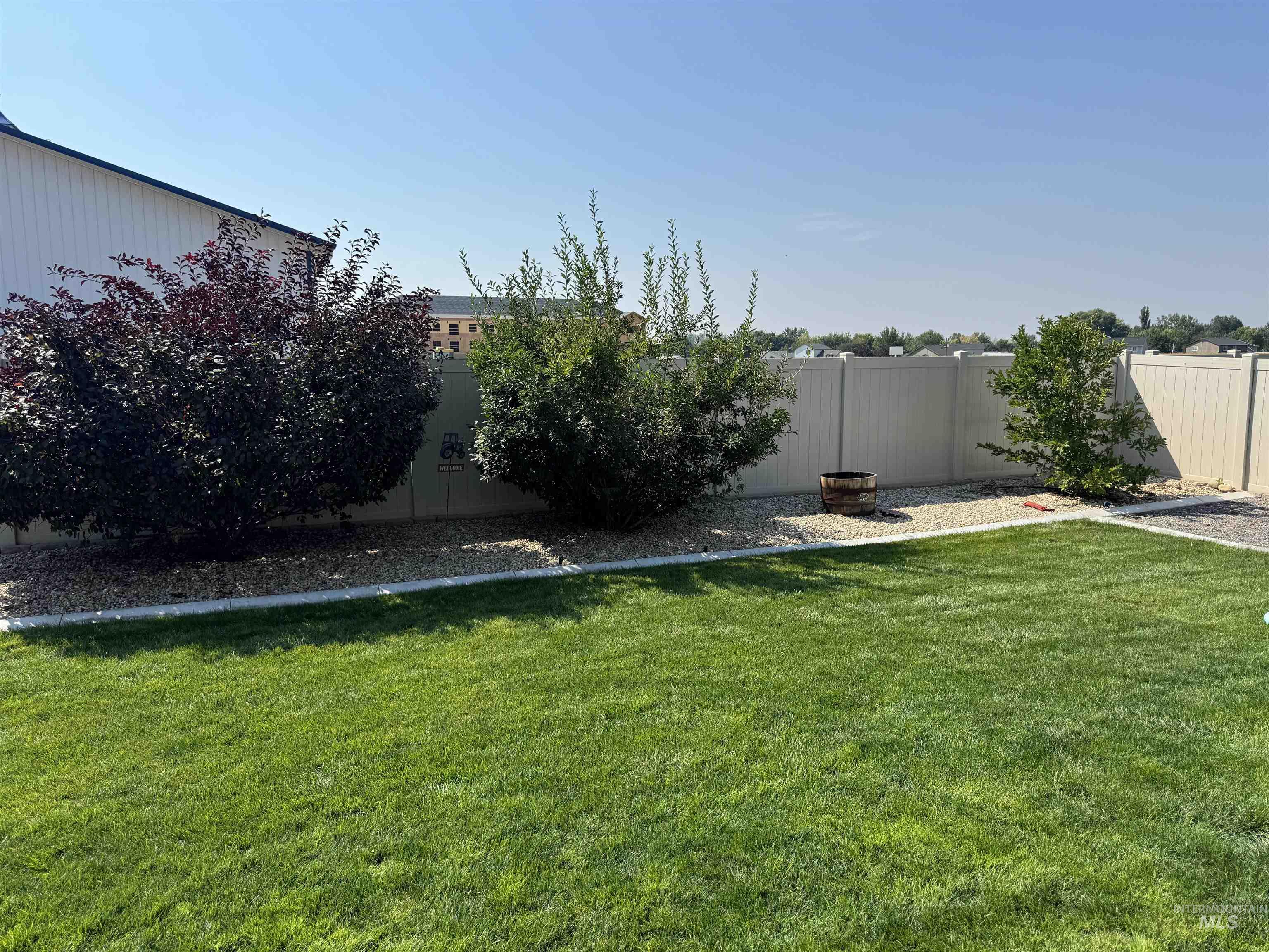 View of fenced backyard