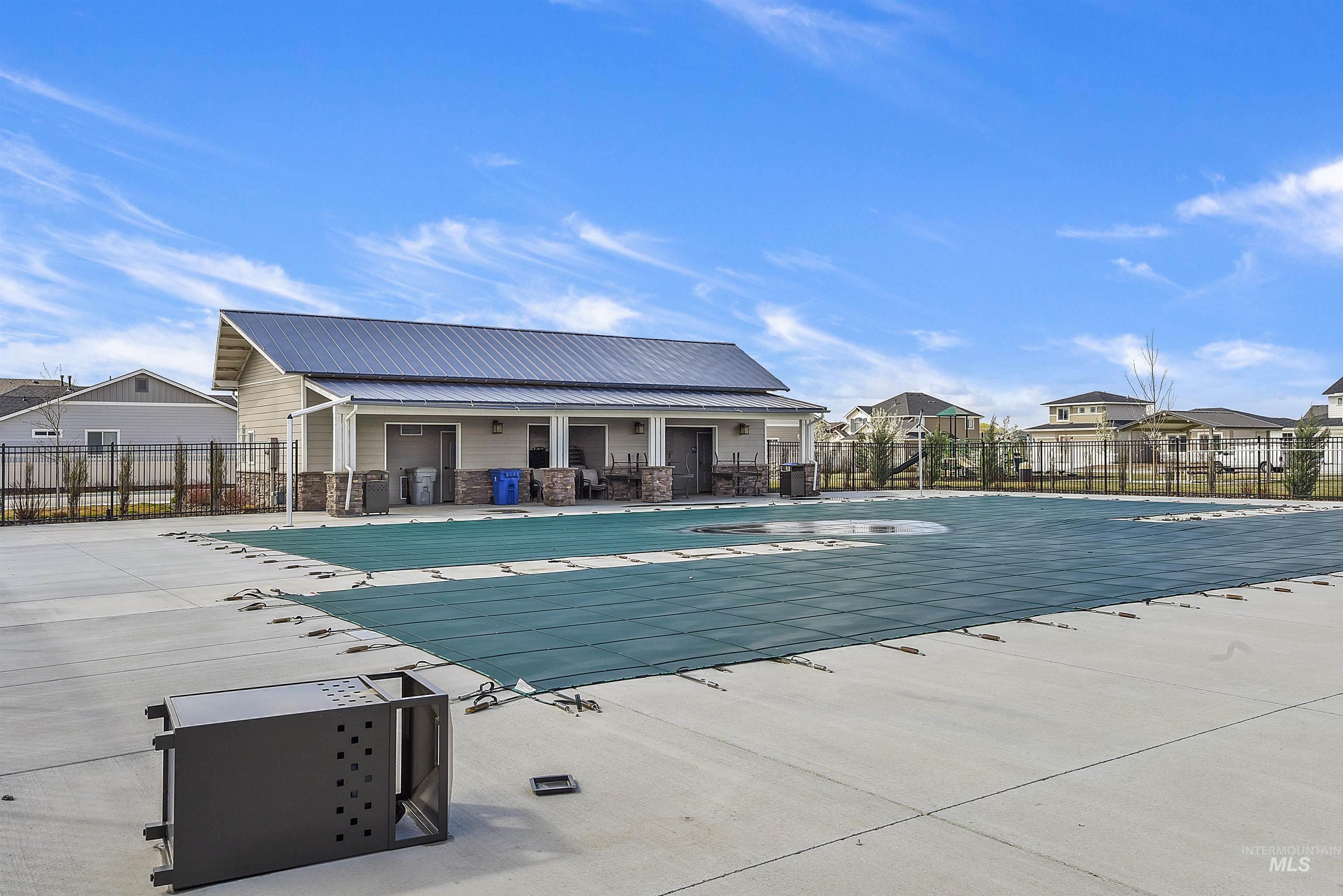 Community pool featuring a patio
