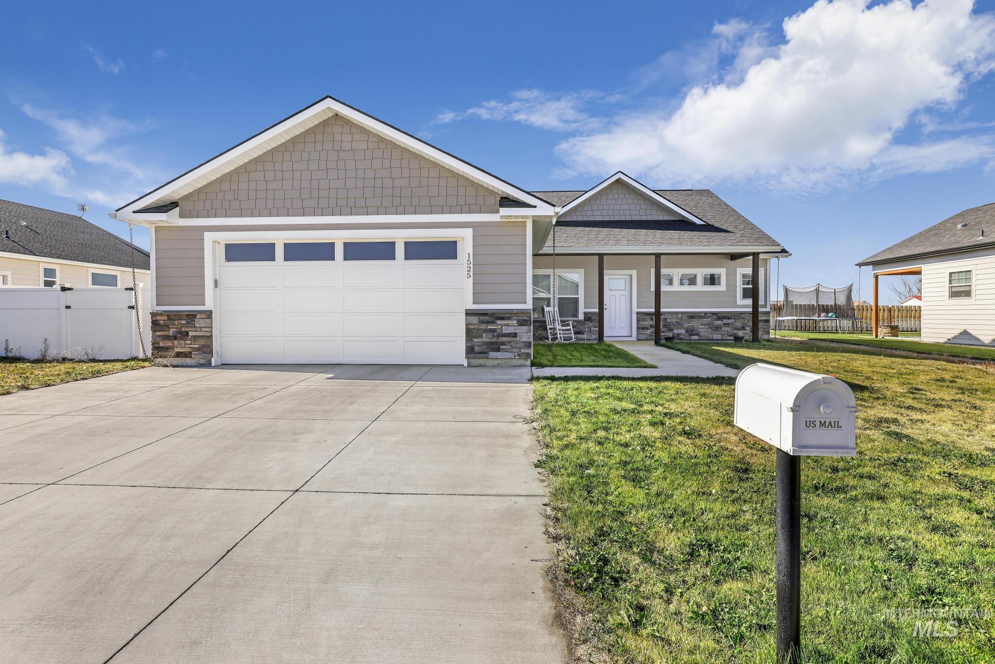 Craftsman house featuring stone siding, concrete driveway, a porch, and an attached garage
