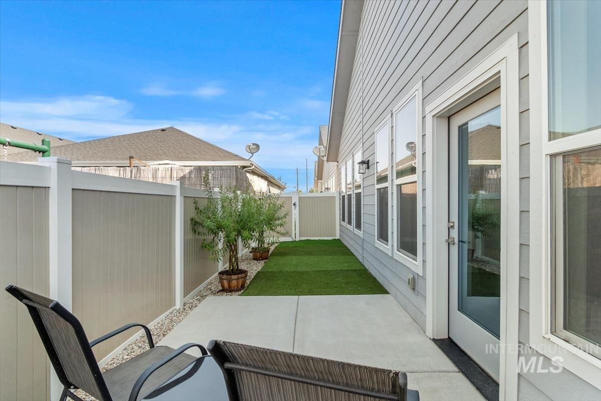 Fenced backyard with a patio area