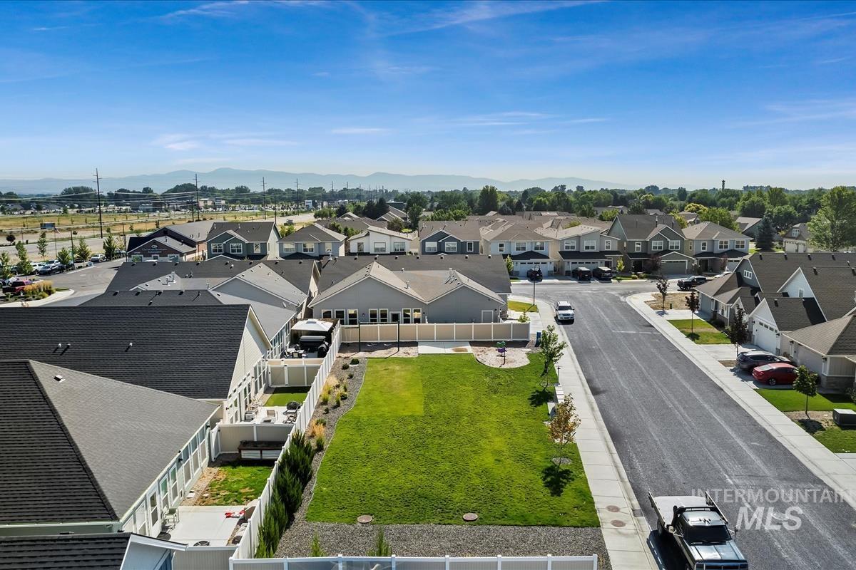 Aerial view of residential area with a mountainous background