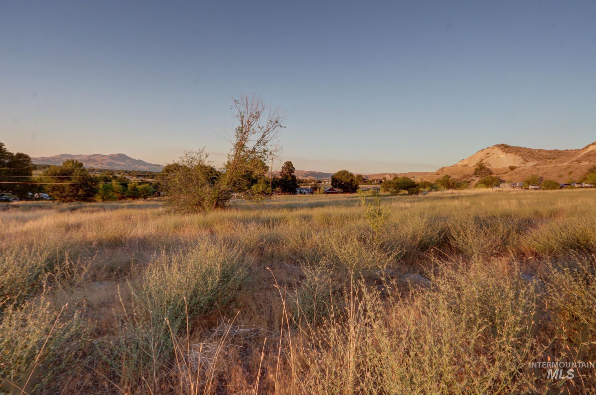 View of mountain background featuring rural landscape