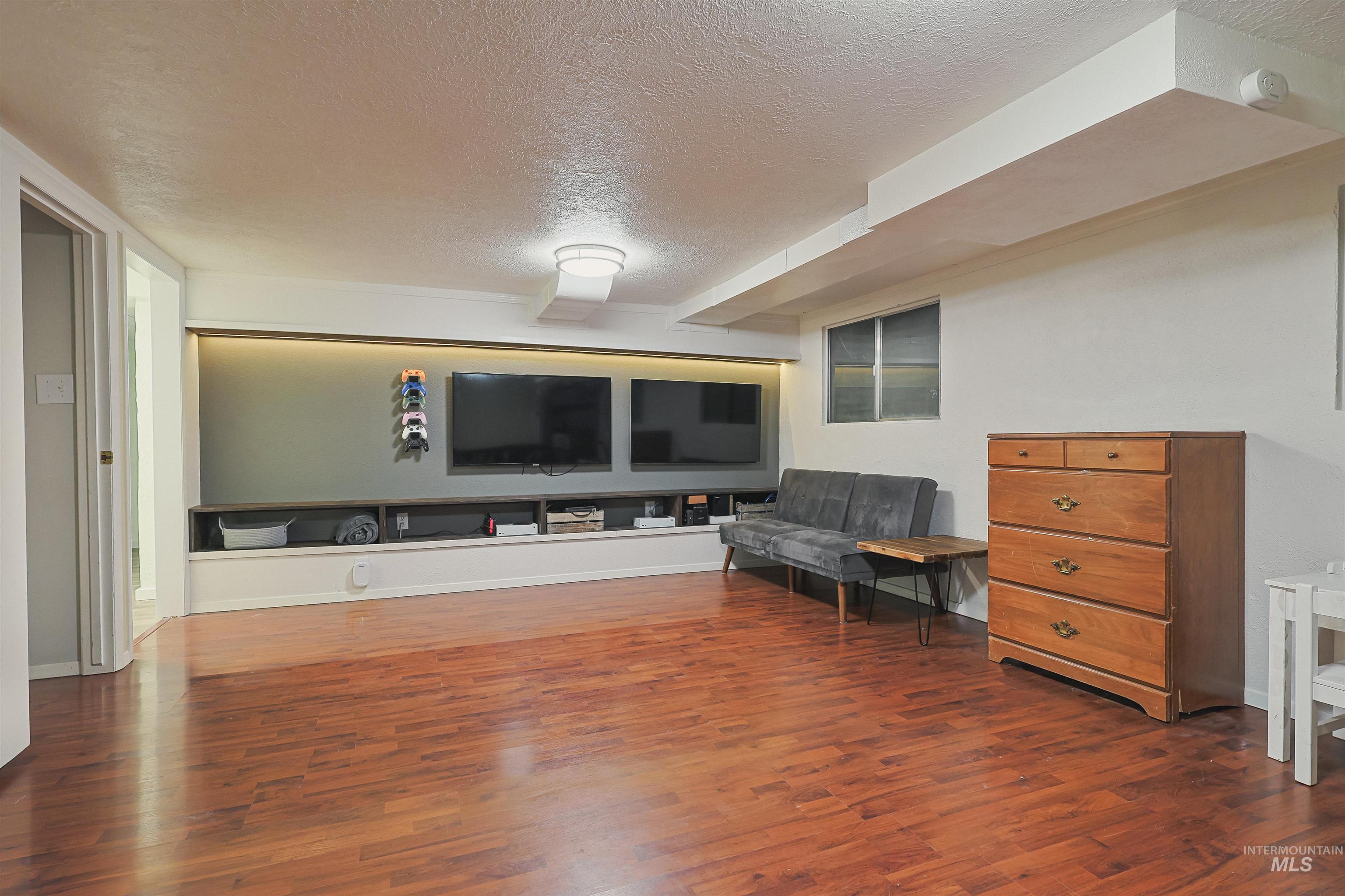 Bedroom featuring light colored carpet and a ceiling fan