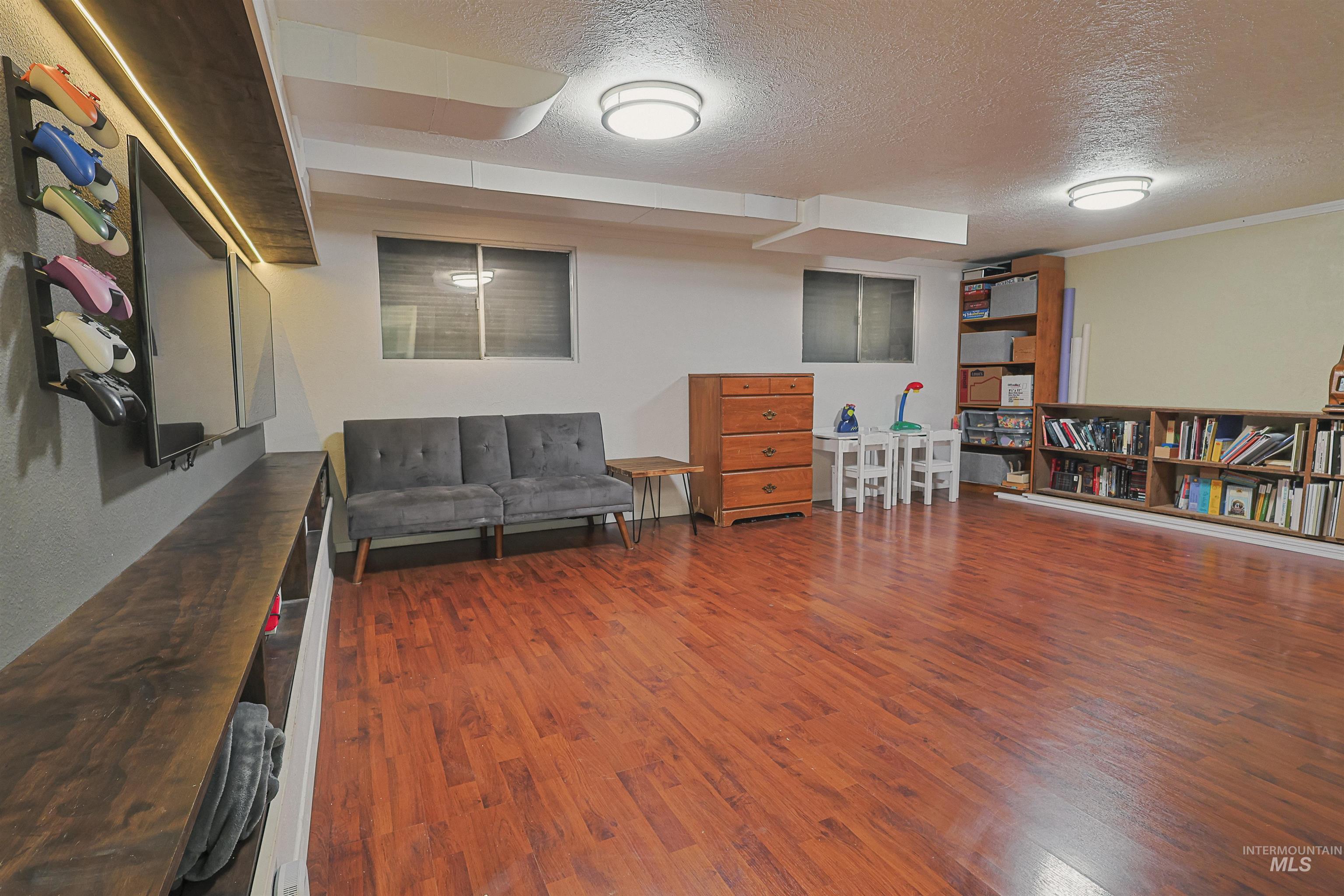 Office space with carpet flooring and a textured ceiling