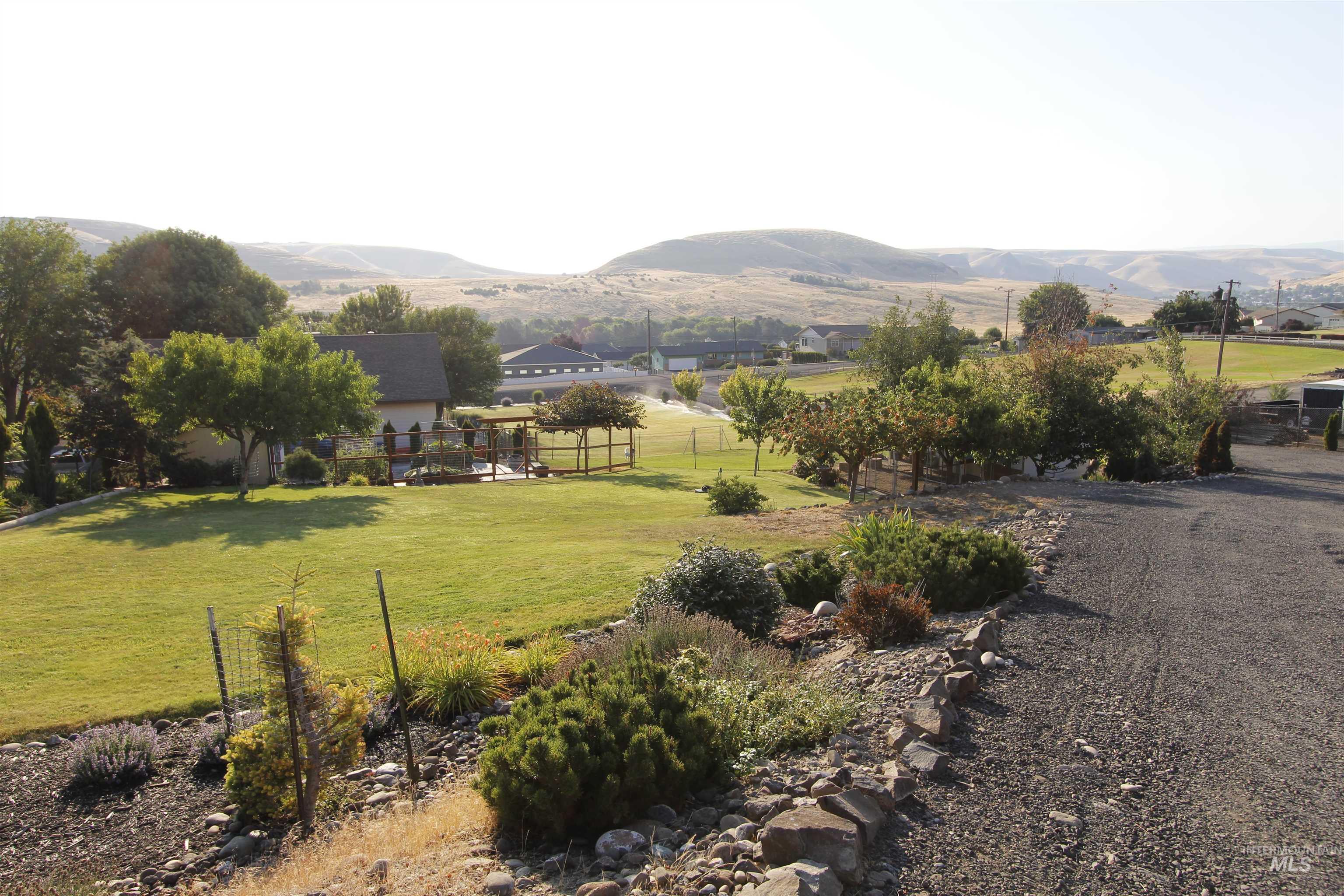 View of yard featuring a mountain view and a rural view