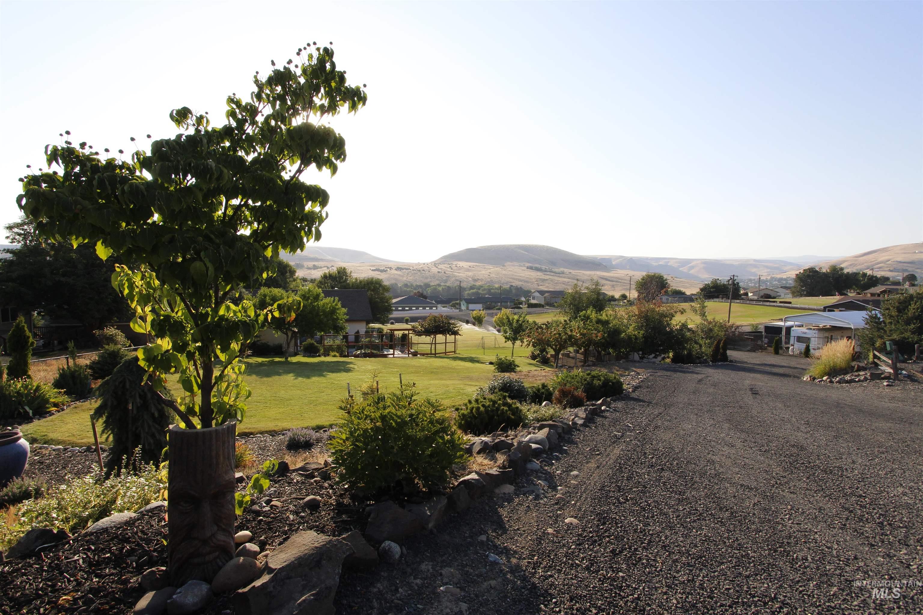 View of mountain backdrop with rural landscape