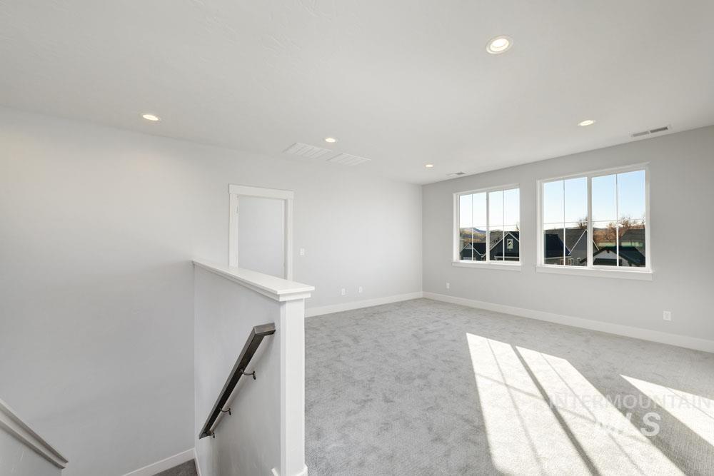 Unfurnished room featuring carpet floors and recessed lighting
