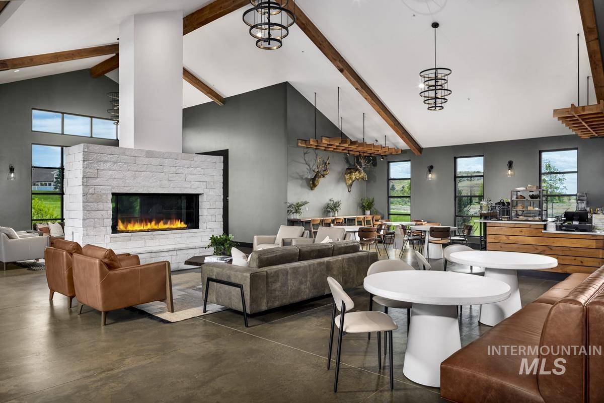 Community lobby with beamed ceiling and high vaulted ceiling