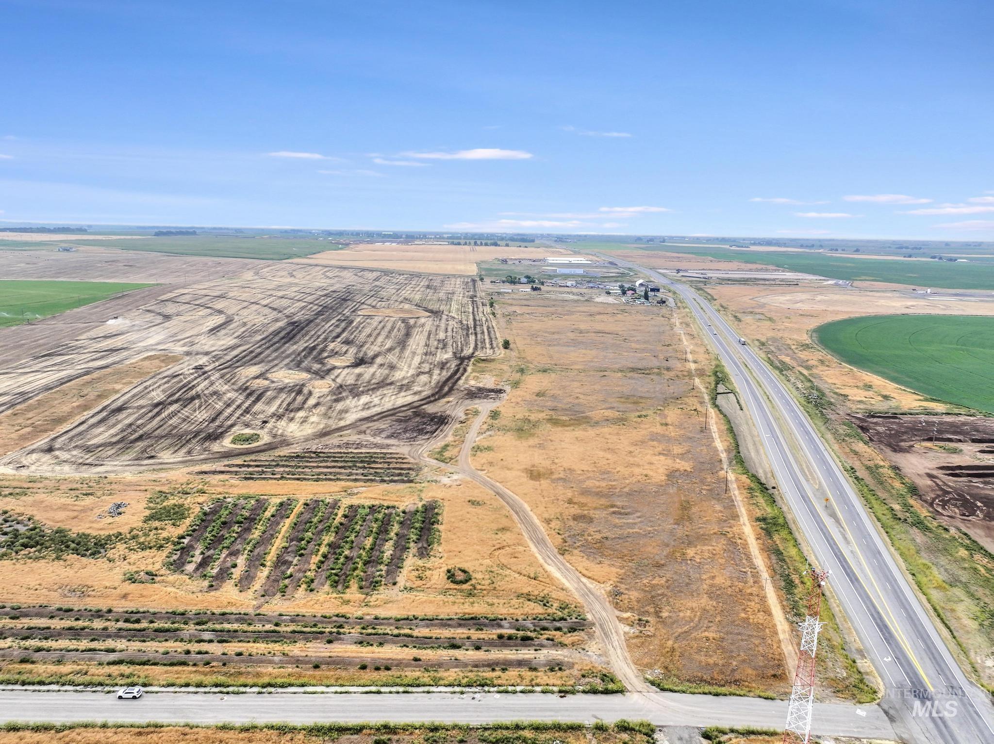 View of rural area featuring large plots for crops