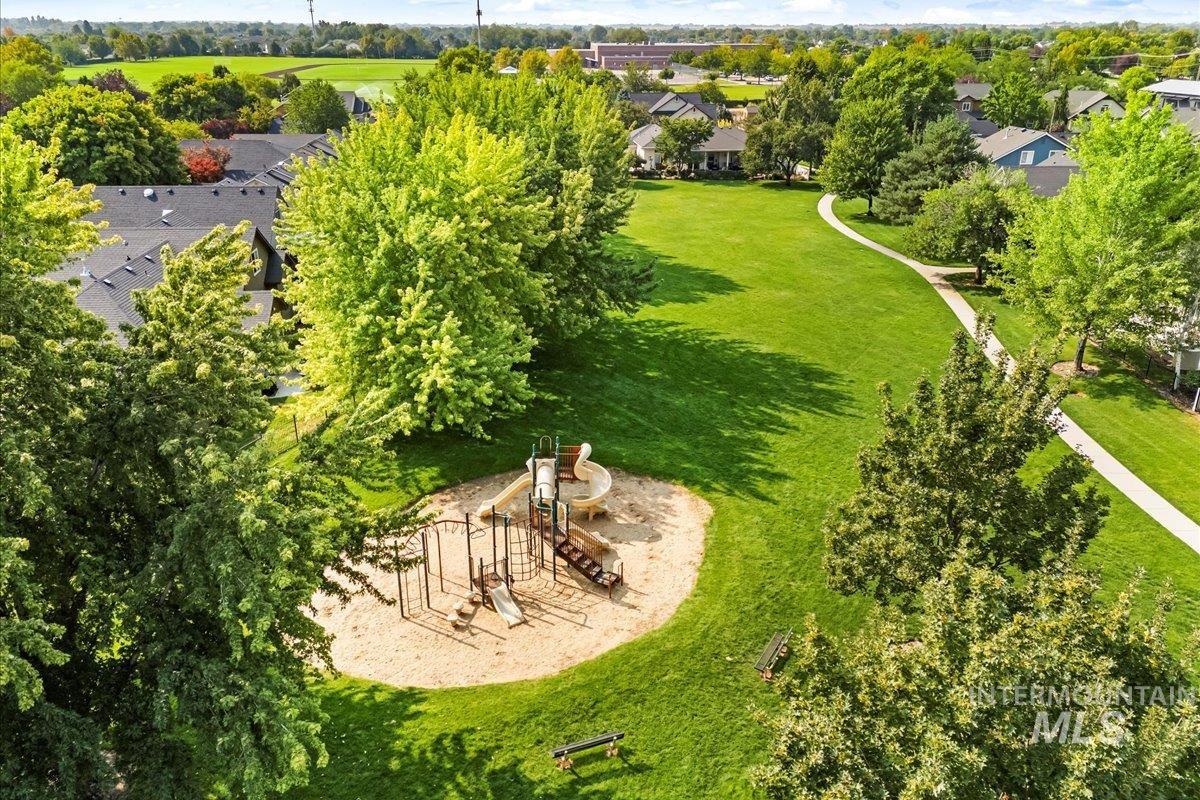 Aerial perspective of suburban area featuring a tree filled landscape