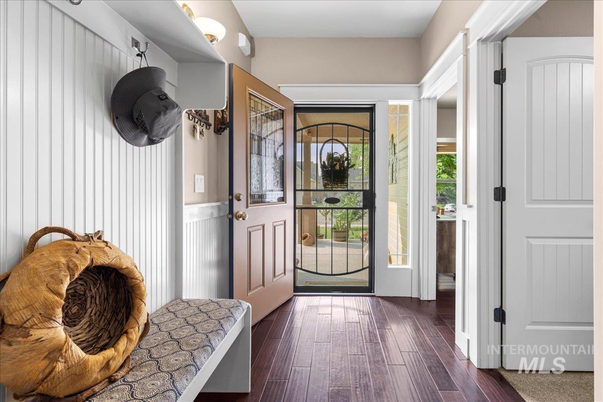 Mudroom featuring dark wood-style flooring