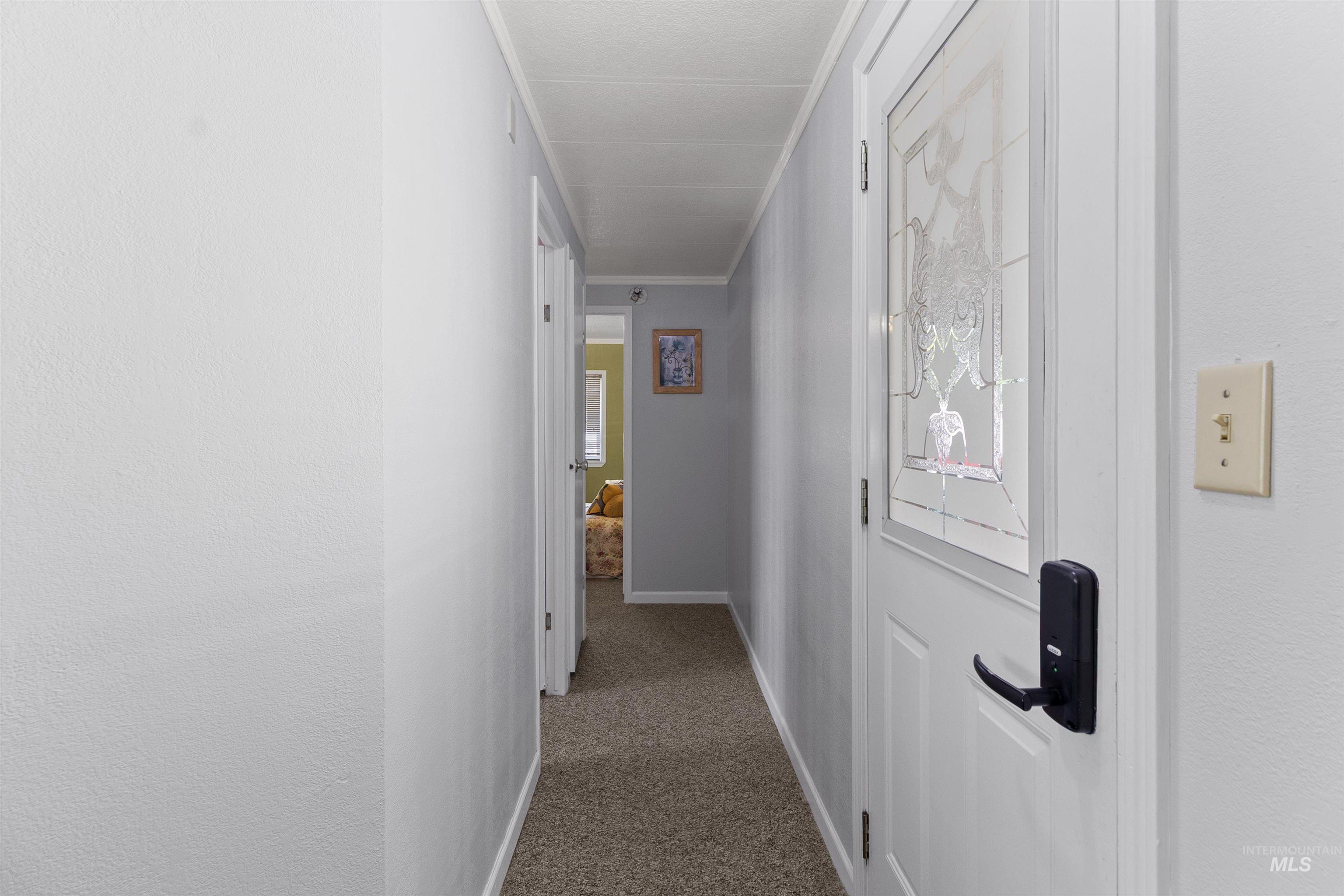 Hall with carpet and ornamental molding