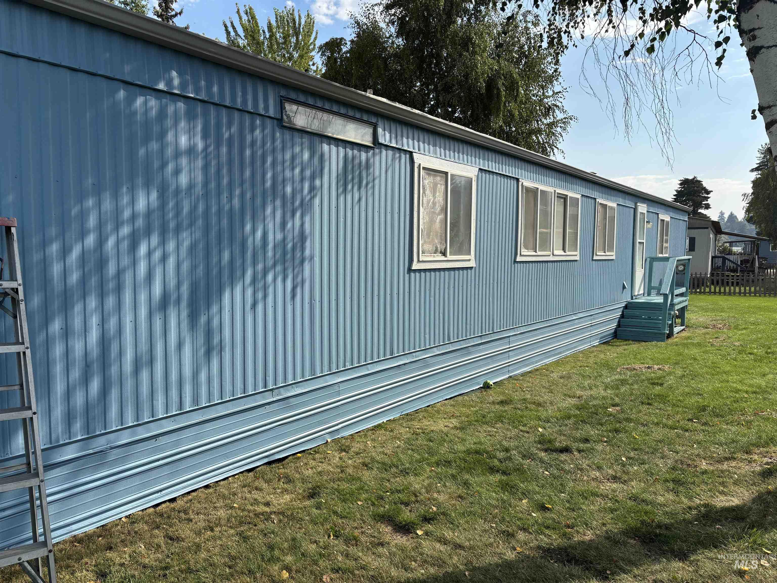 View of home's exterior with a lawn