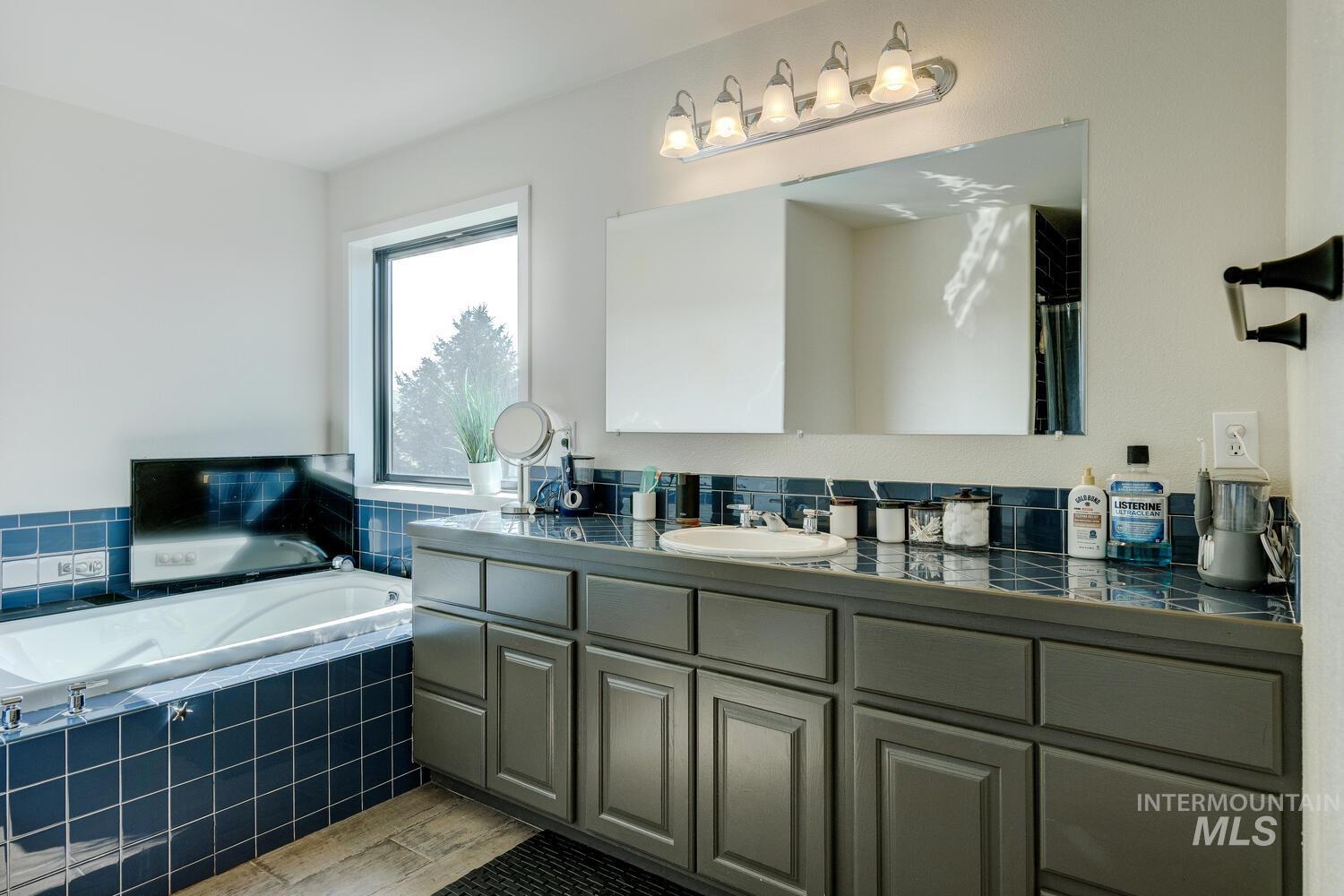 Bathroom featuring a bath and vanity