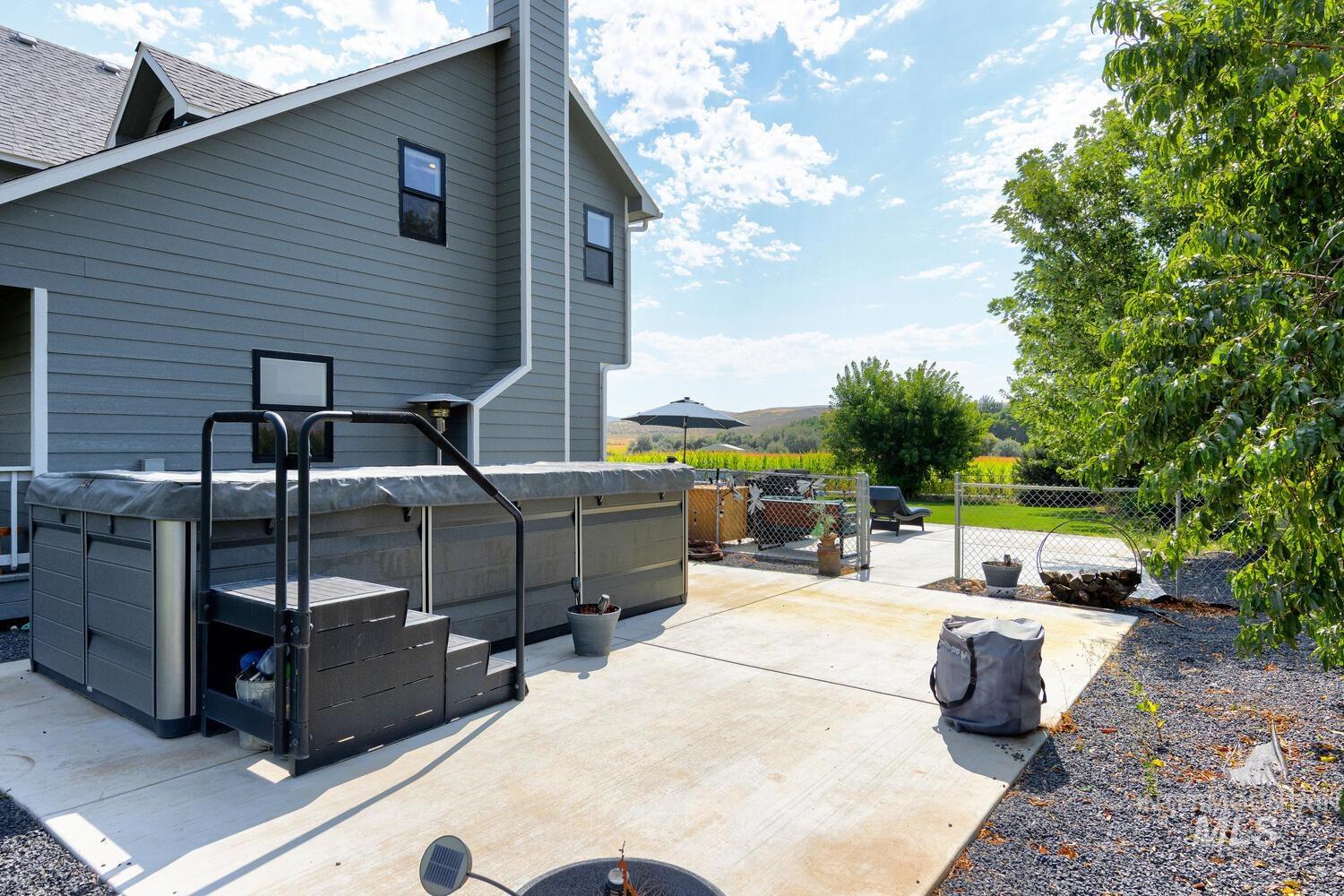 View of side patio / terrace featuring swim spa