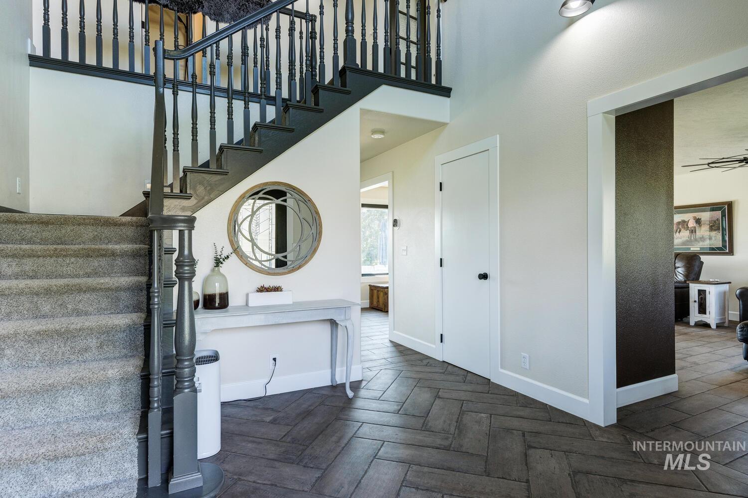 Staircase with a towering ceiling
