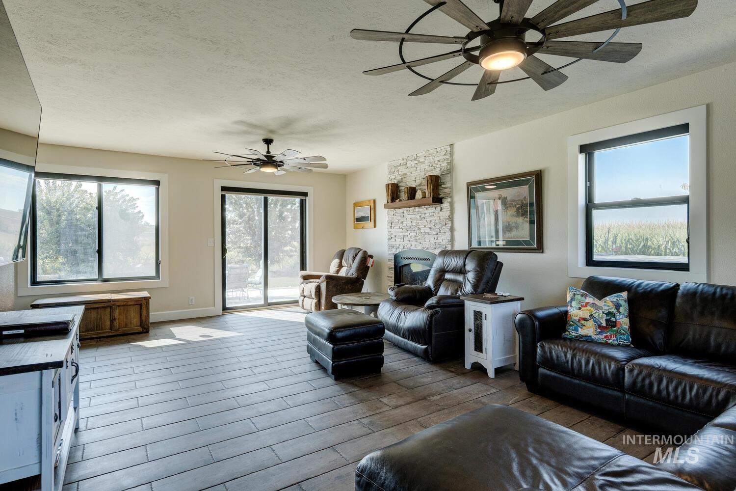 Living area with tiled floors, and ceiling fan