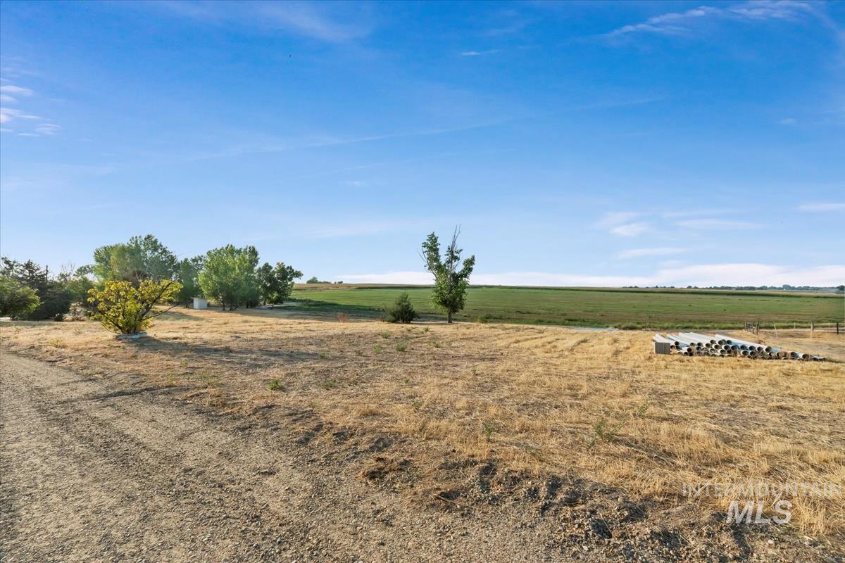 View of yard with a rural view