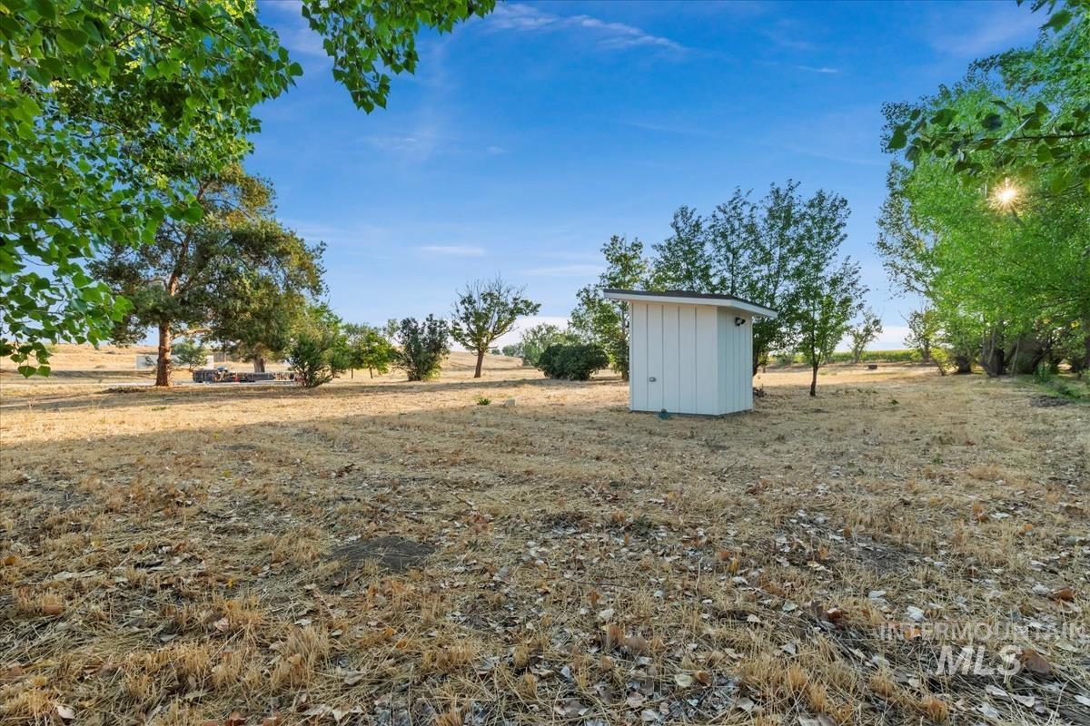 View of yard featuring a storage shed