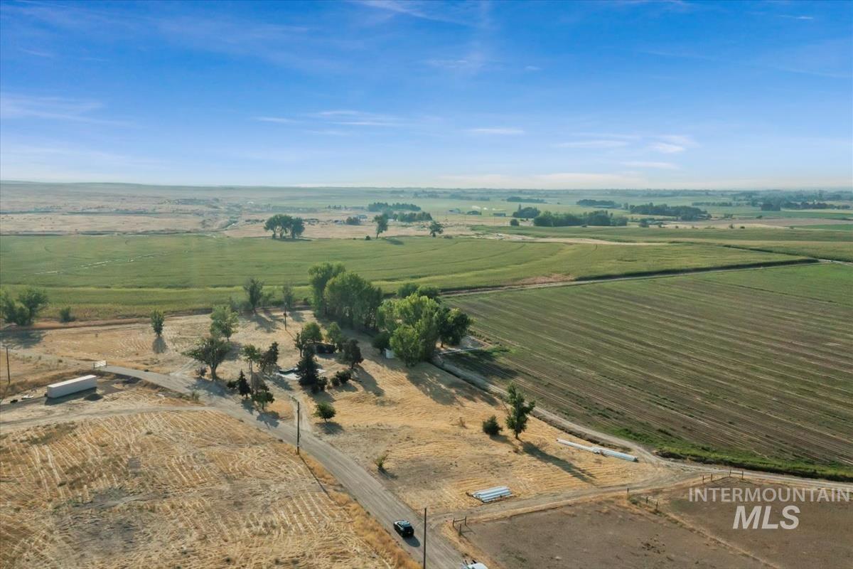 Aerial view of property and surrounding area featuring rural landscape