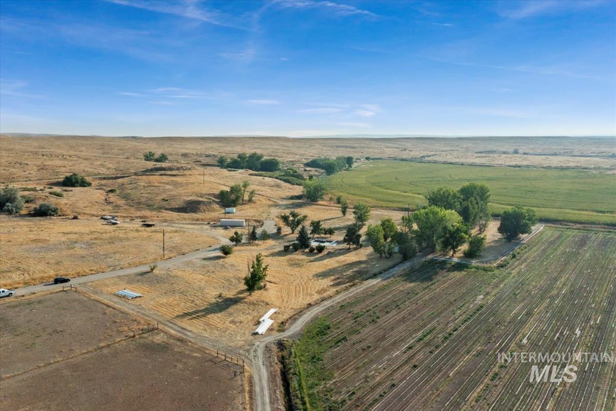 Aerial view of property and surrounding area with rural landscape
