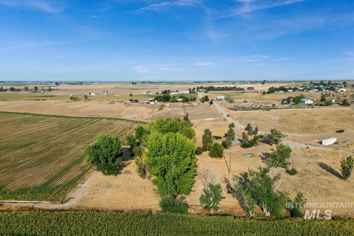Aerial view of property and surrounding area with rural landscape