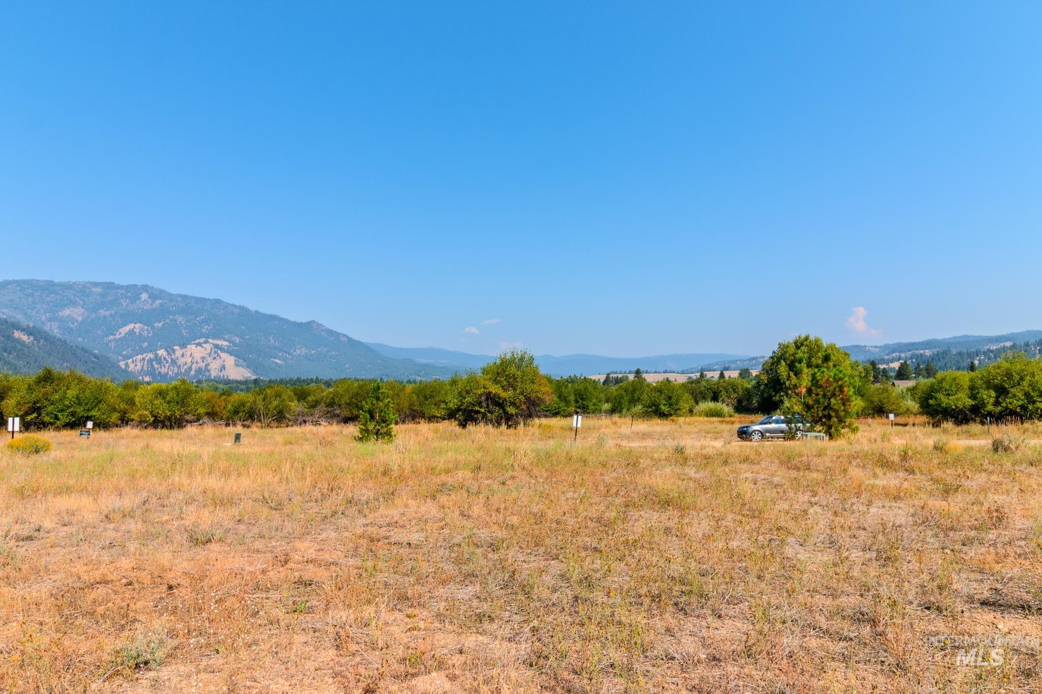 View of mountain background featuring rural landscape