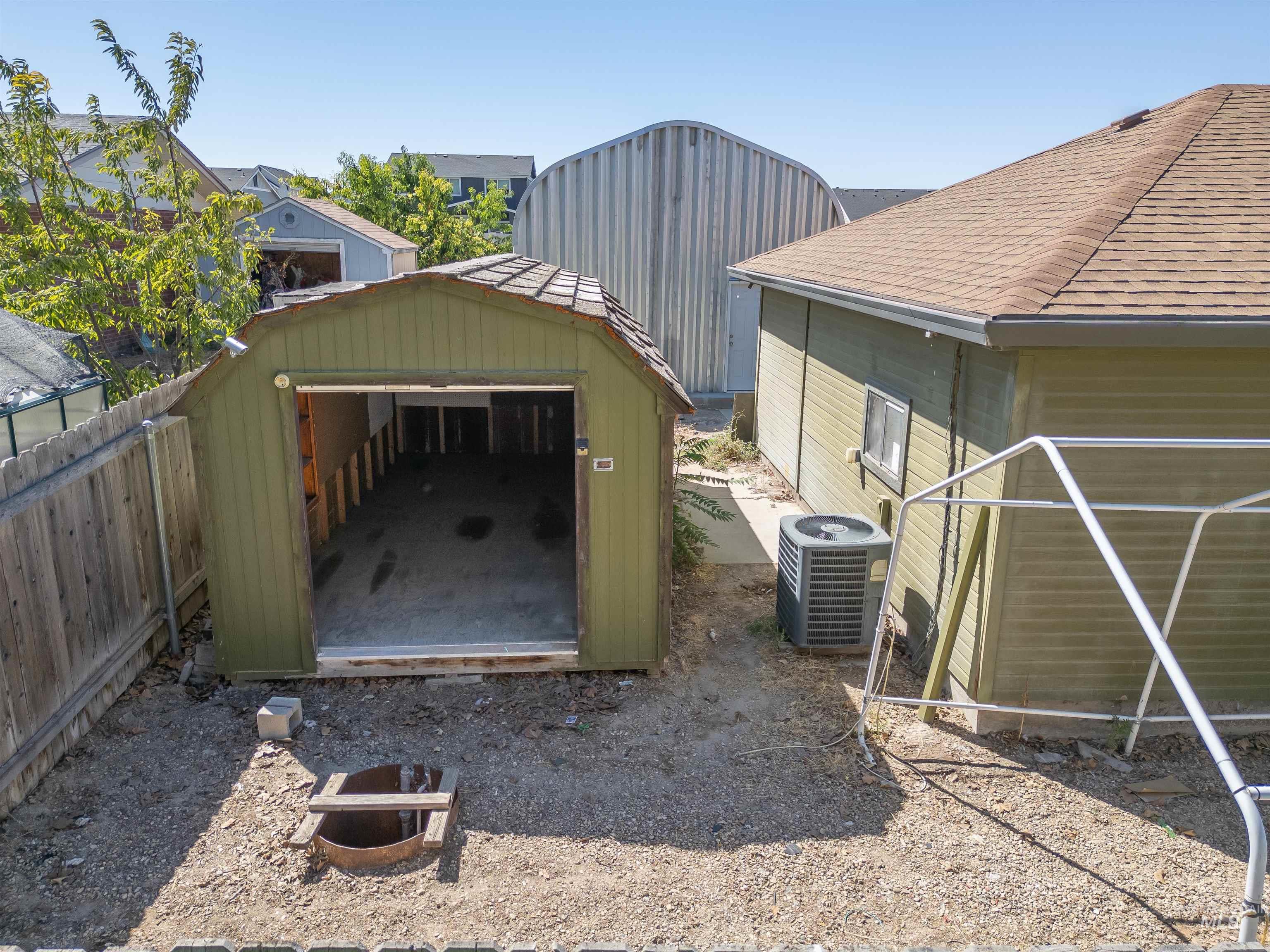 Garage featuring a storage shed