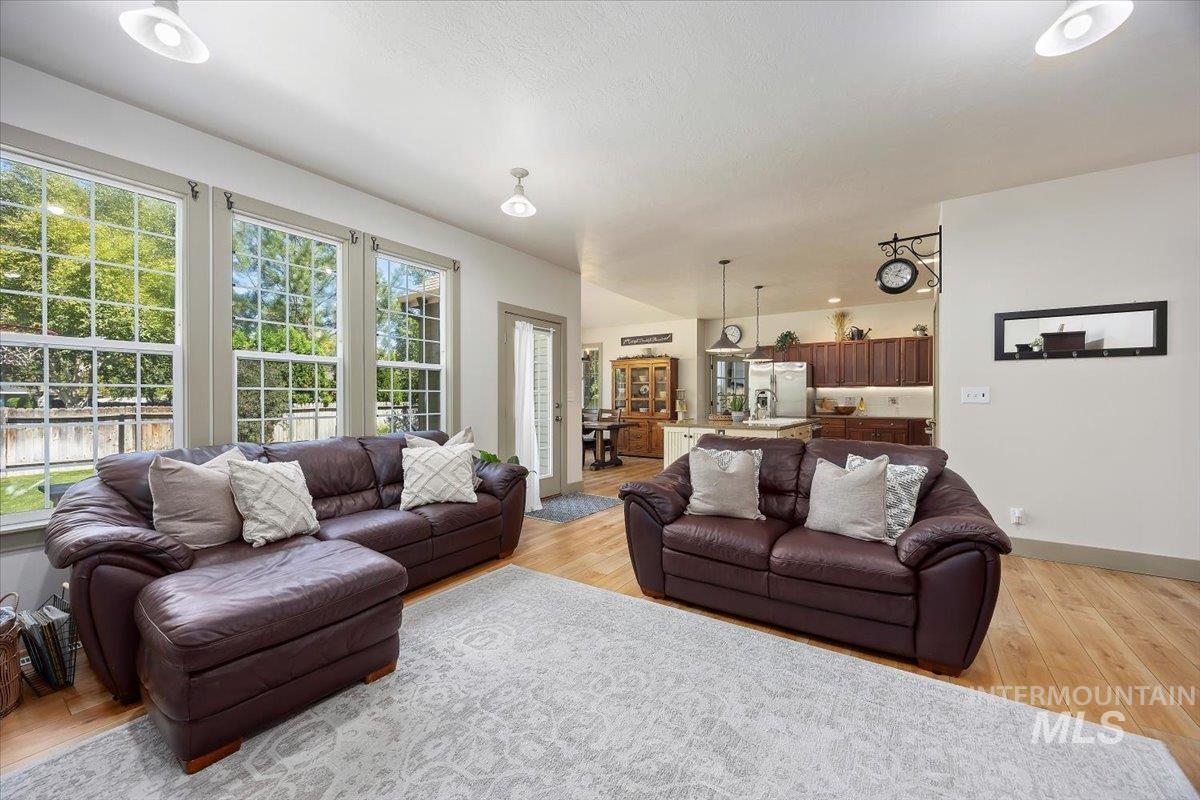Living room featuring light wood-style floors and baseboards