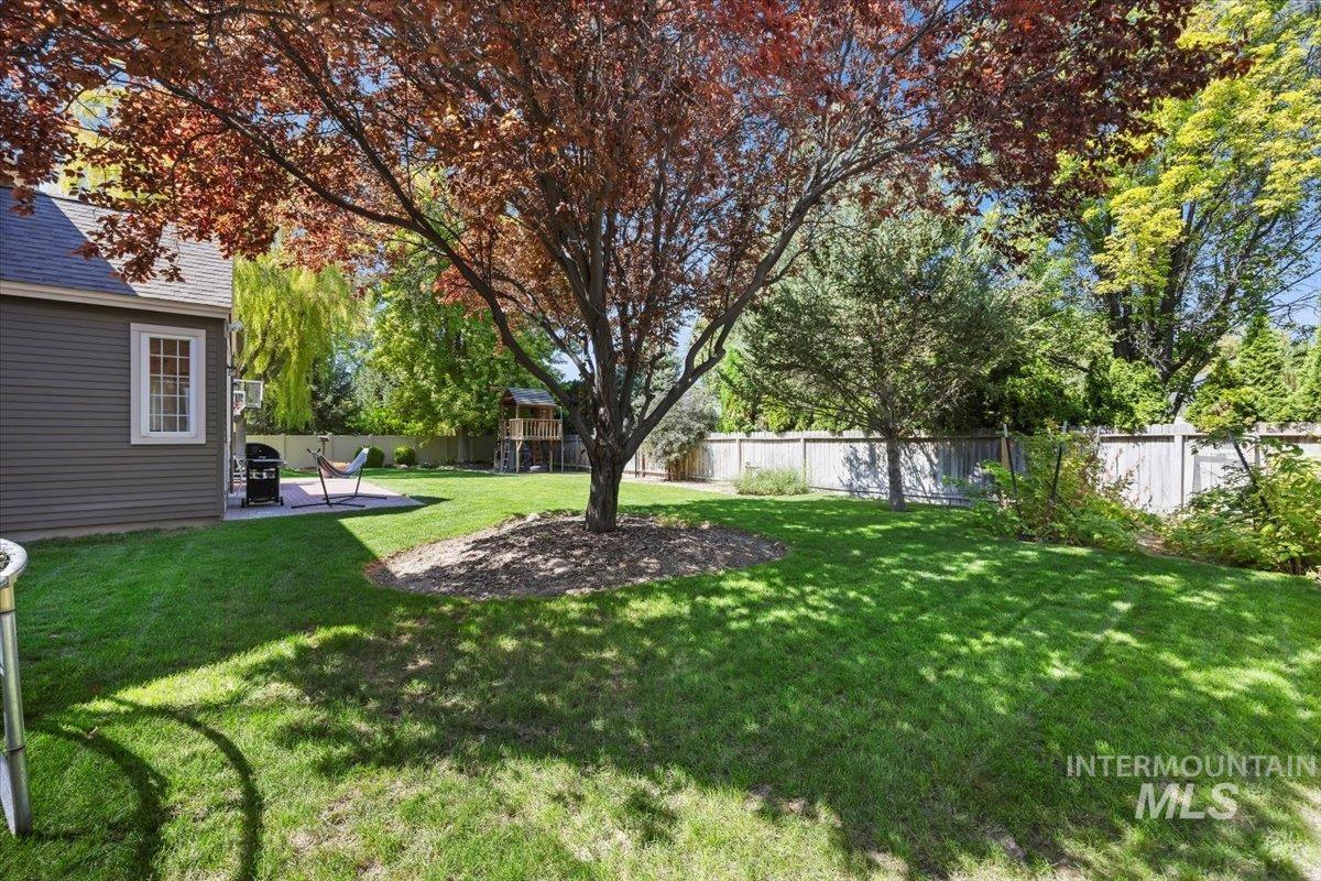 Fenced backyard with a patio