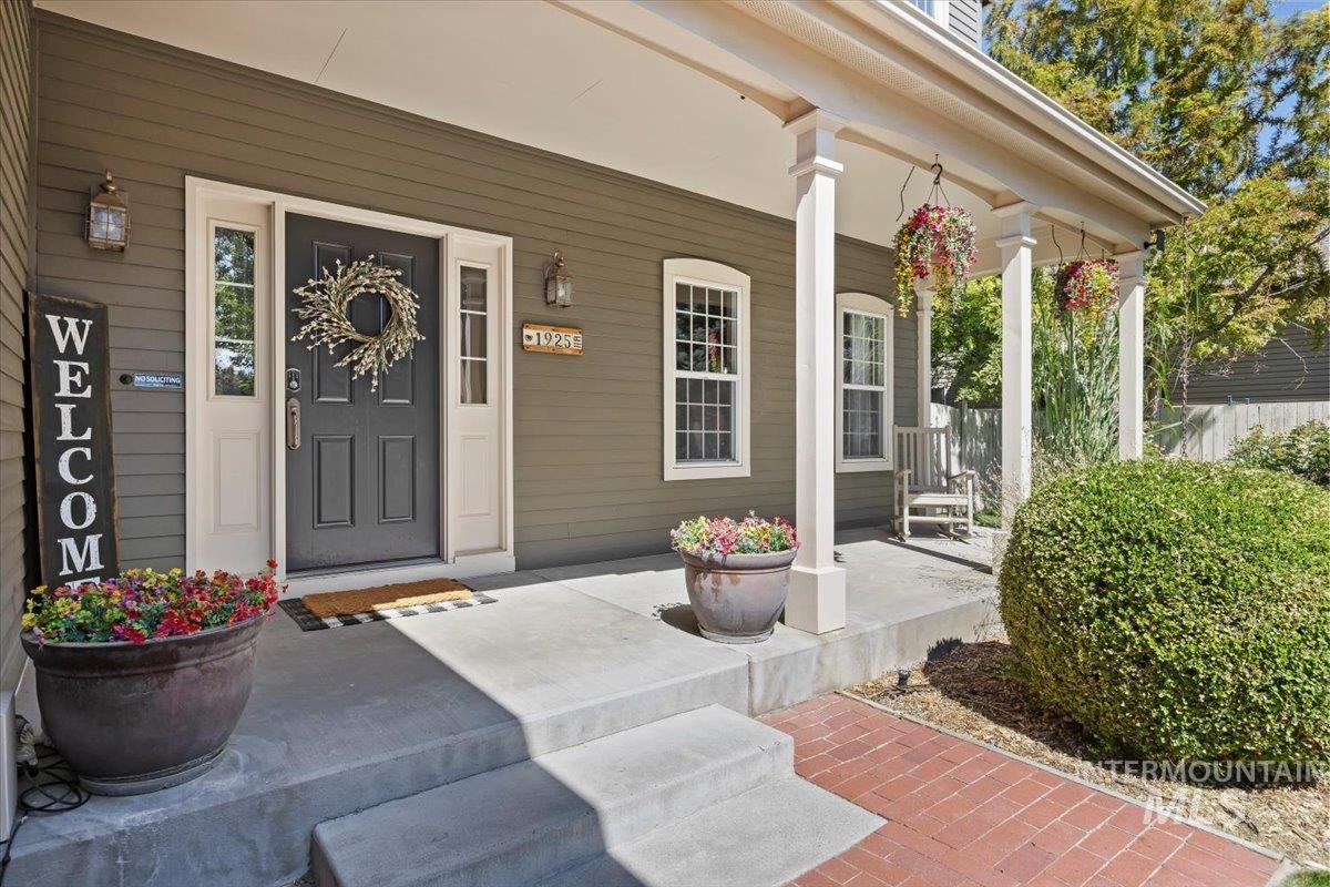 Entrance to property featuring covered porch