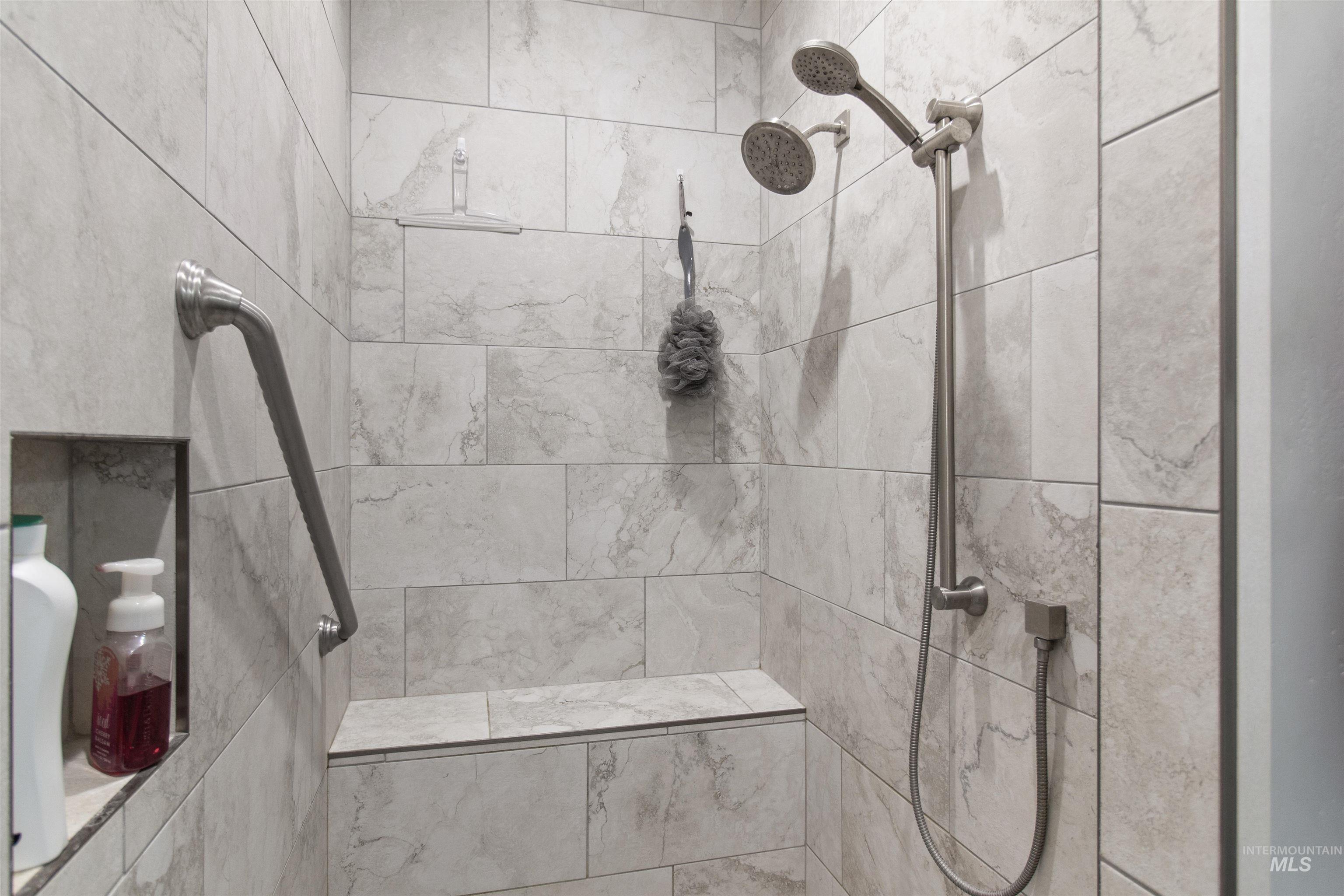 Full bathroom with a tile shower