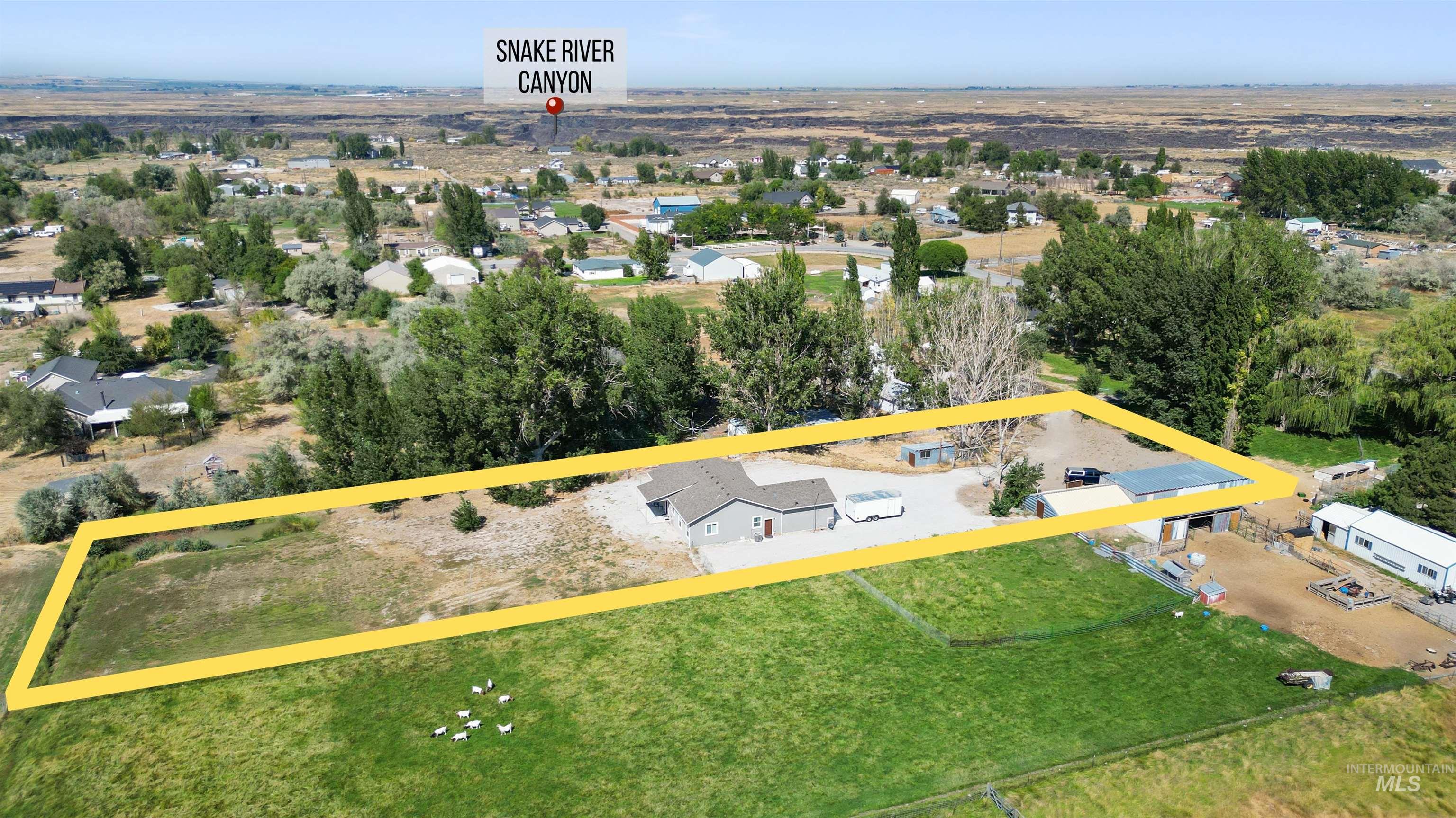 Aerial overview of property's location featuring property parcel outlined