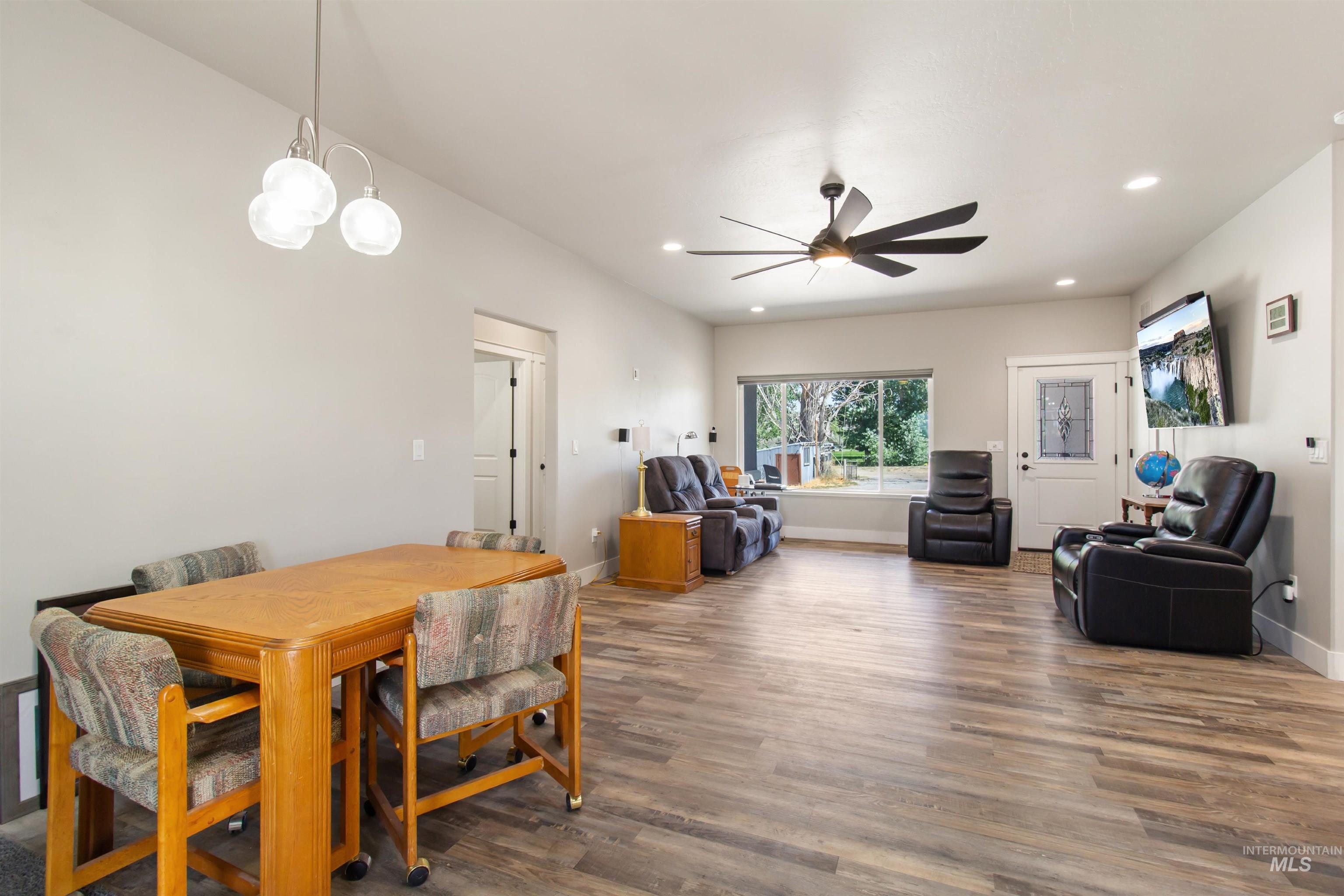 Dining area with wood finished floors, recessed lighting, and a ceiling fan