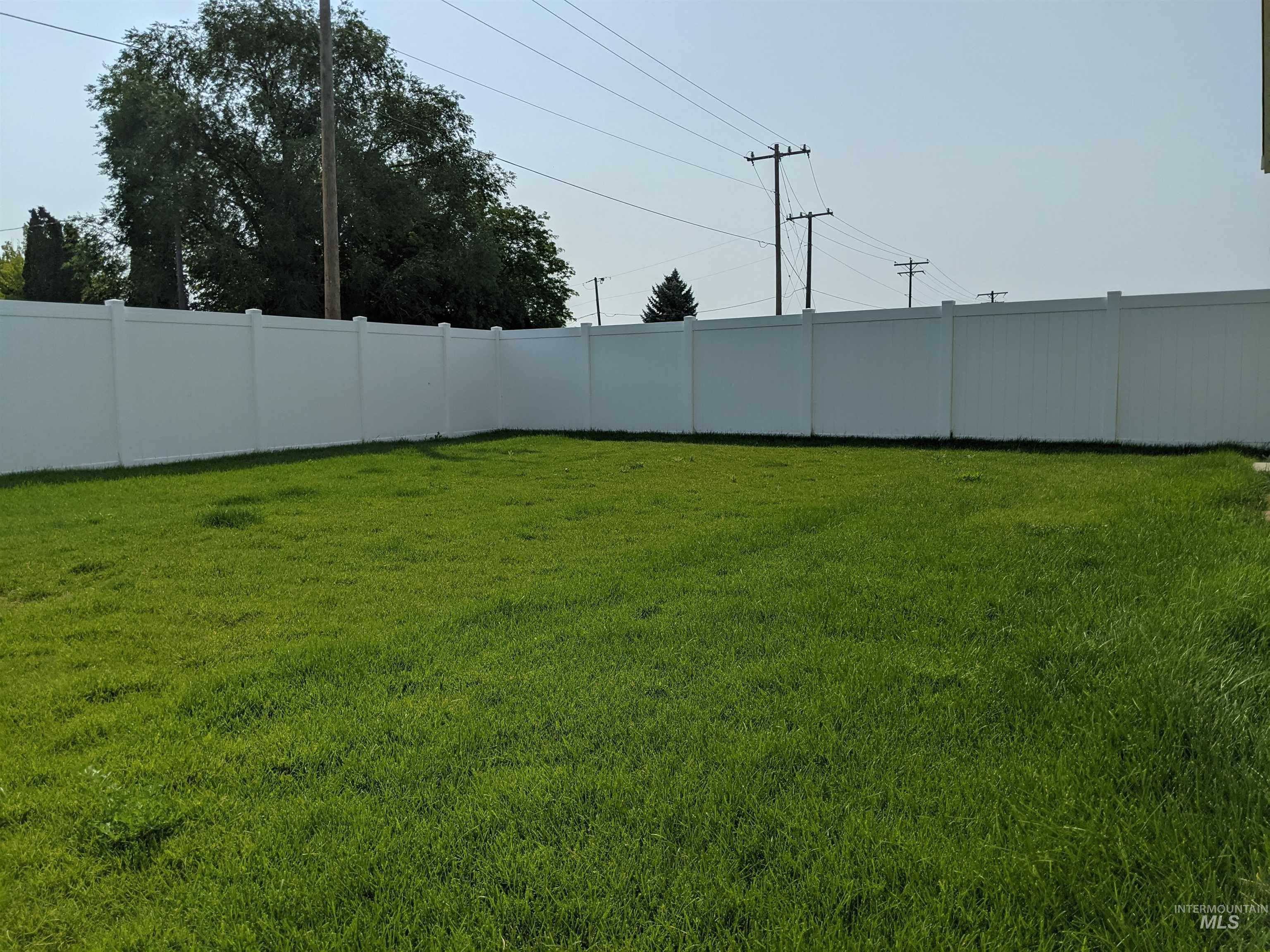 View of fenced backyard