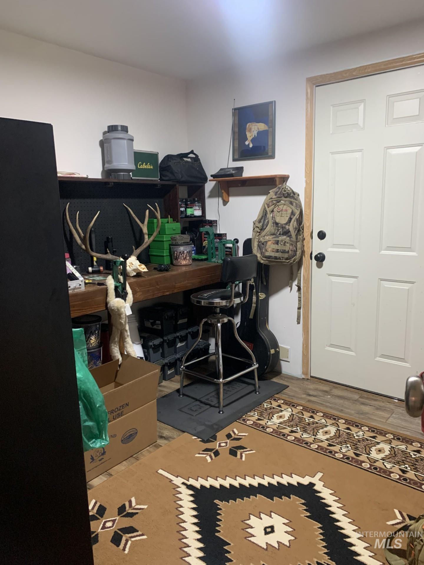 Office area featuring wood finished floors
