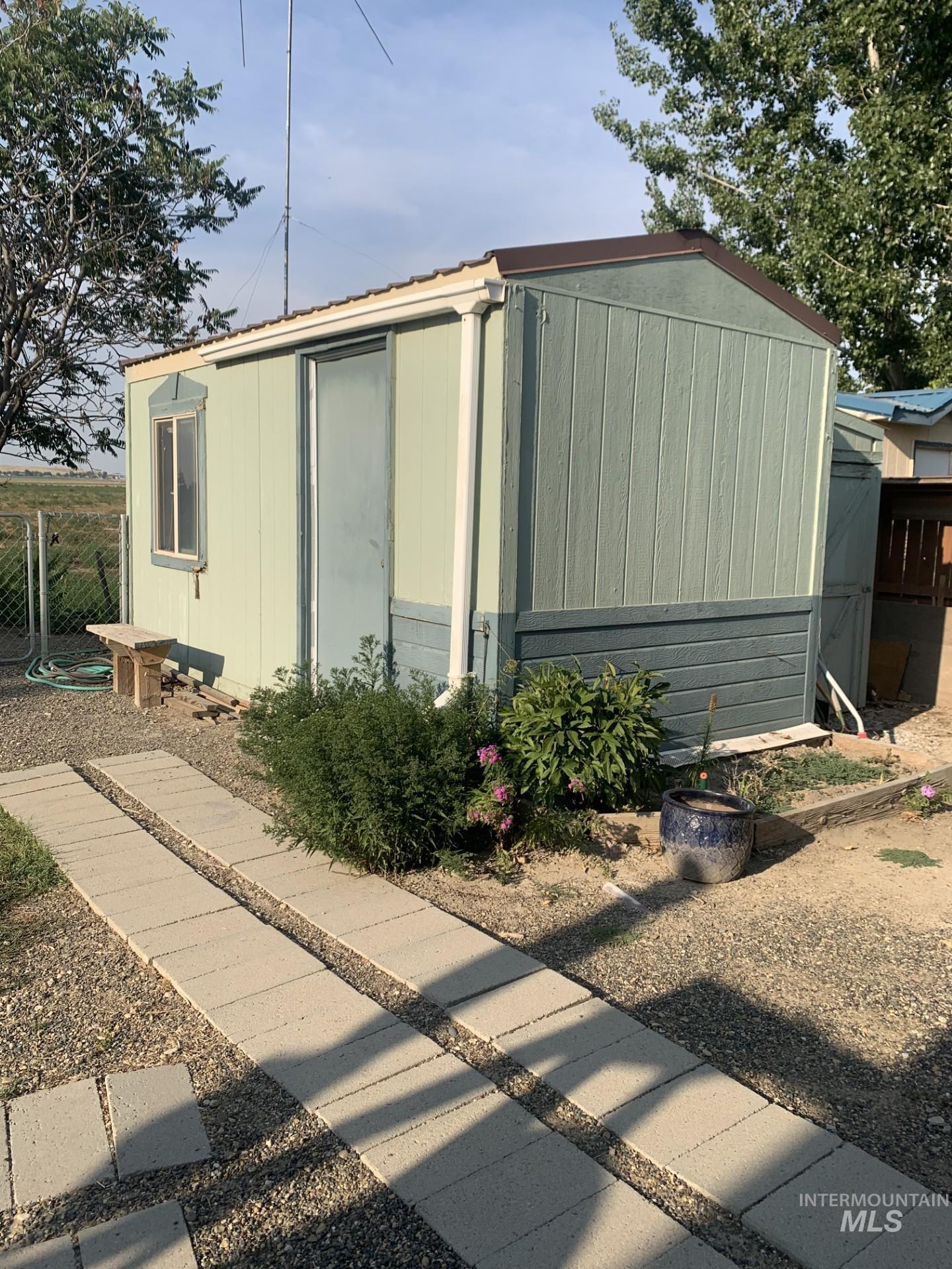 View of side of property with an outbuilding
