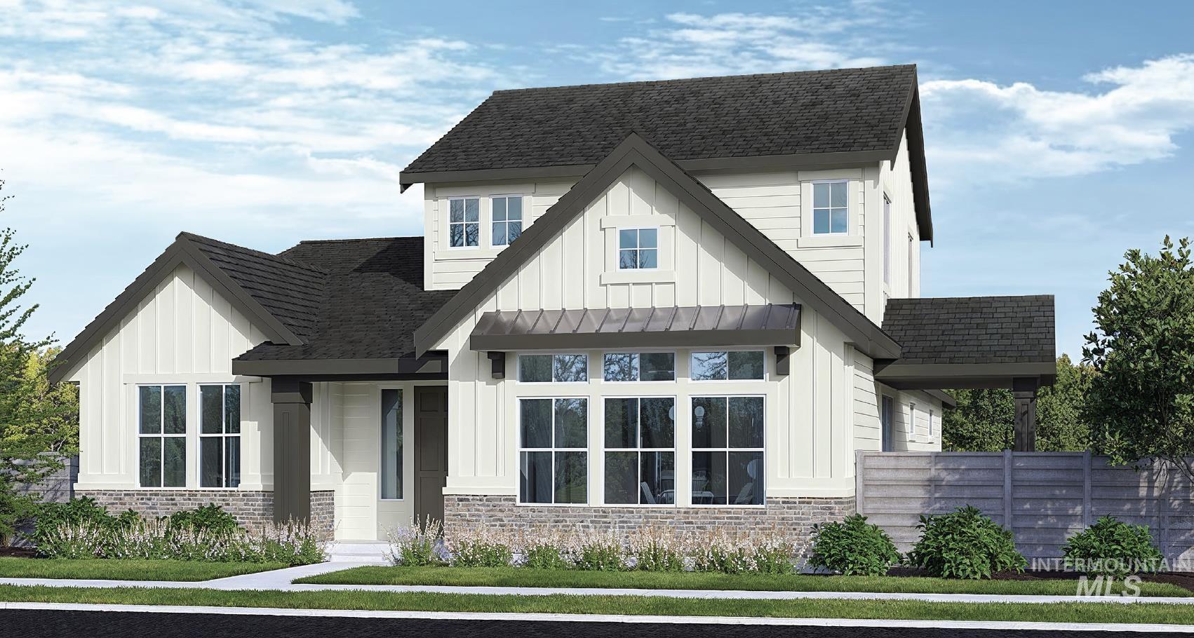 Modern farmhouse style home featuring board and batten siding, roof with shingles, and brick siding