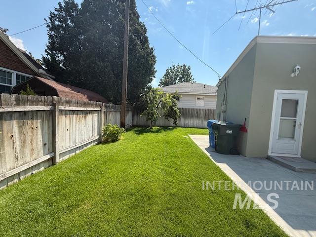 View of fenced backyard
