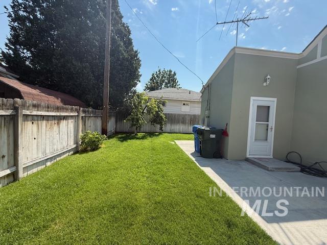 View of fenced backyard