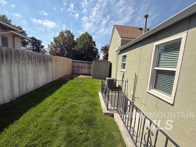 View of fenced backyard