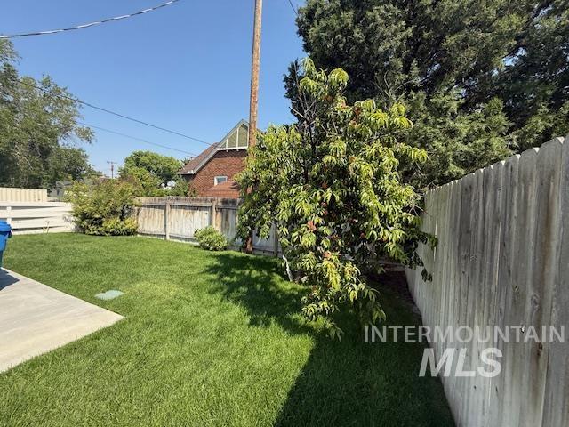View of fenced backyard