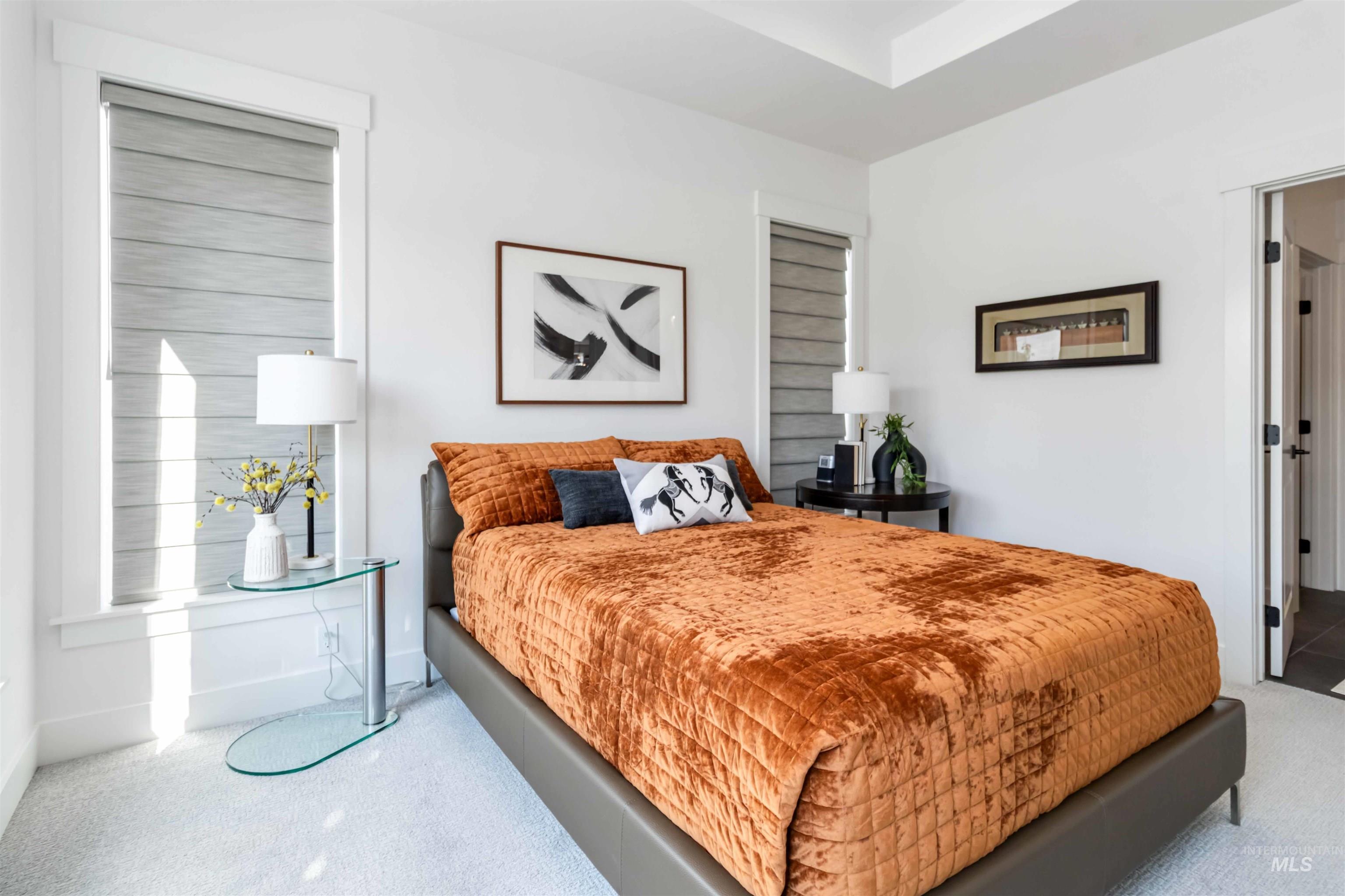 Bedroom with carpet floors and baseboards
