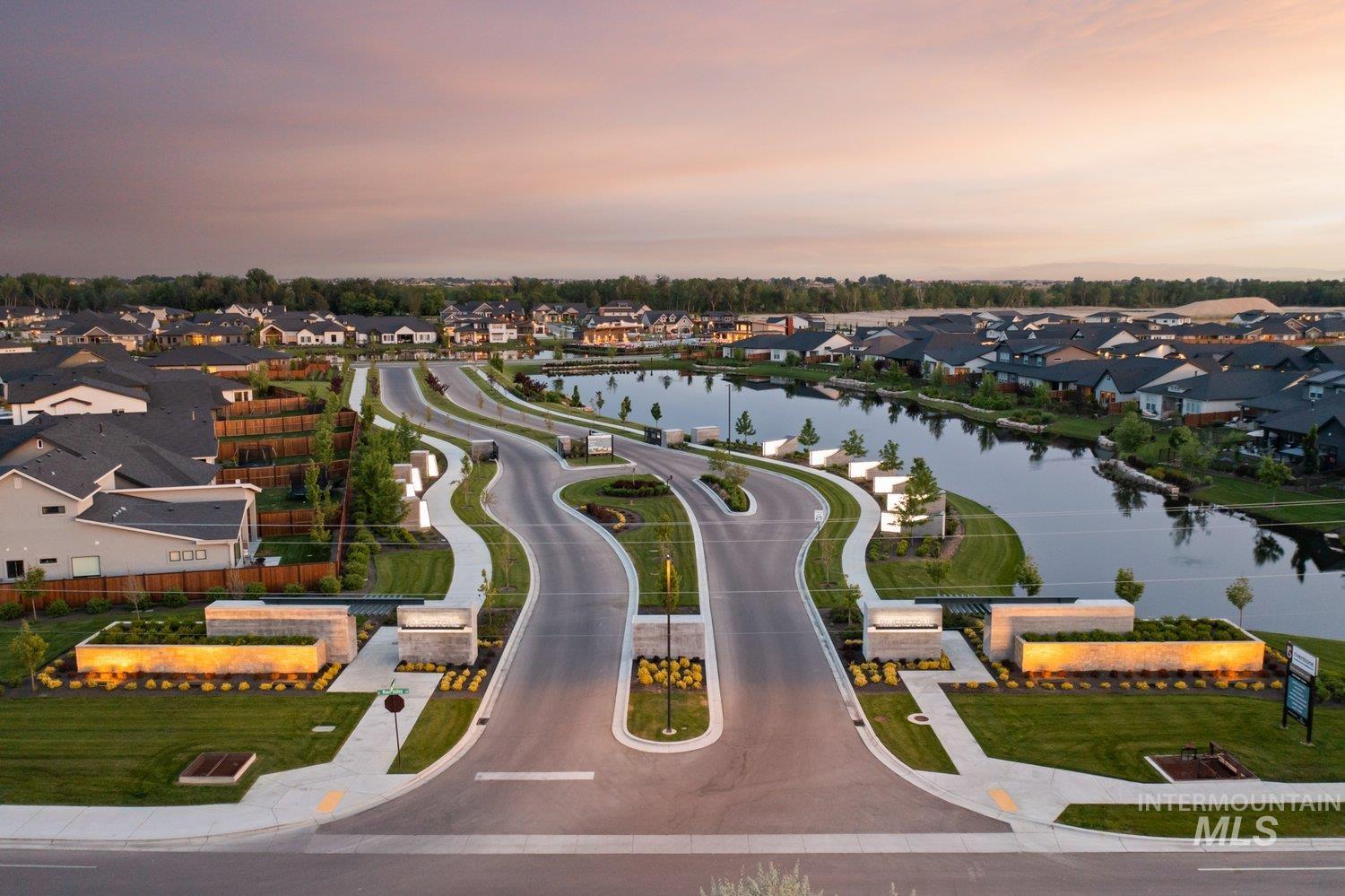 Aerial perspective of suburban area with a large body of water