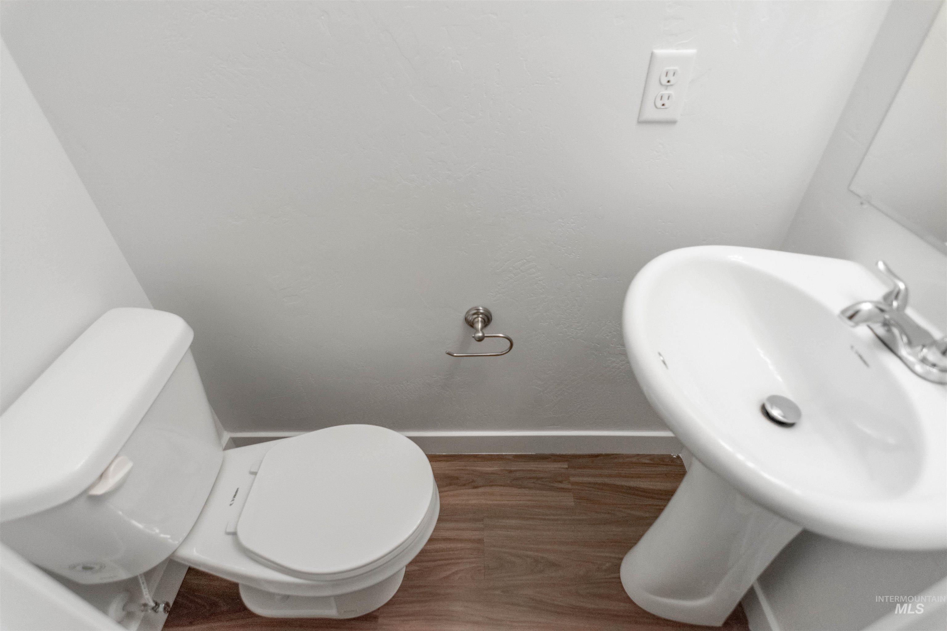 Bathroom with baseboards and toilet