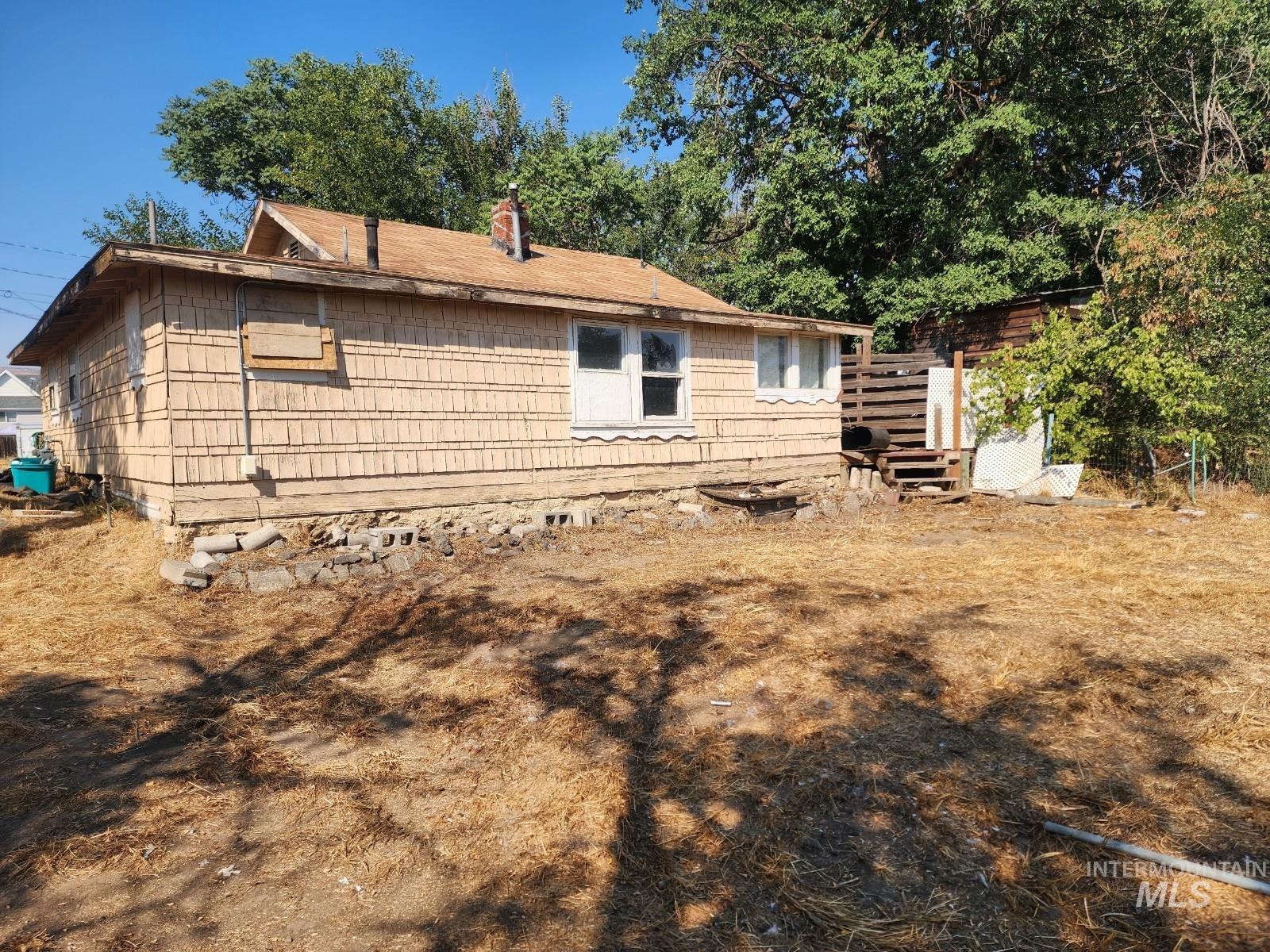 Rear view of property with a chimney