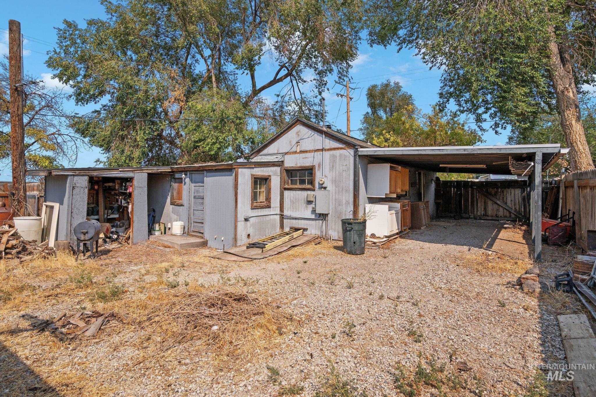 View of outbuilding featuring an attached carport